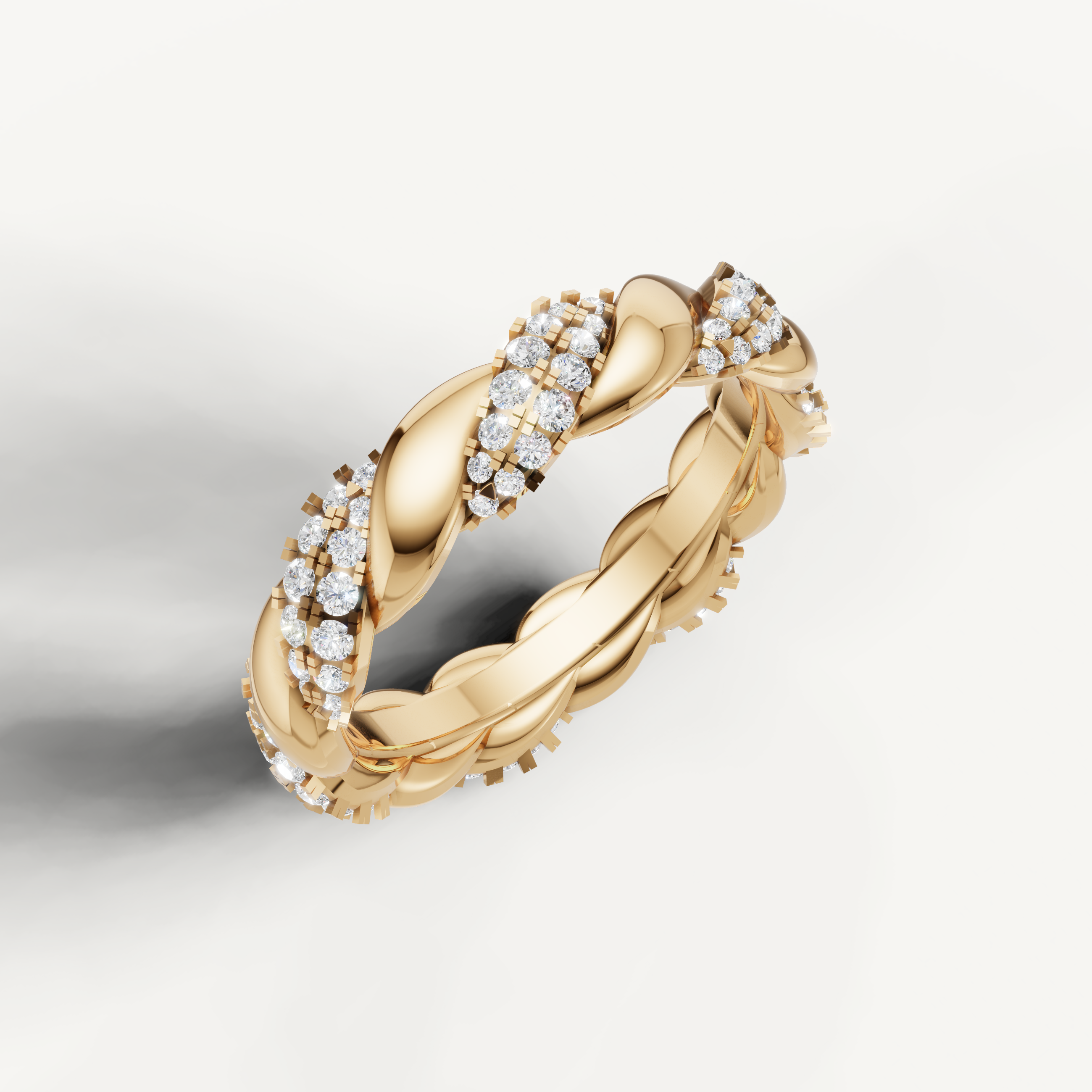 Elegant yellow gold diamond wedding band by Raul Diamonds featuring an intricate braided rope style