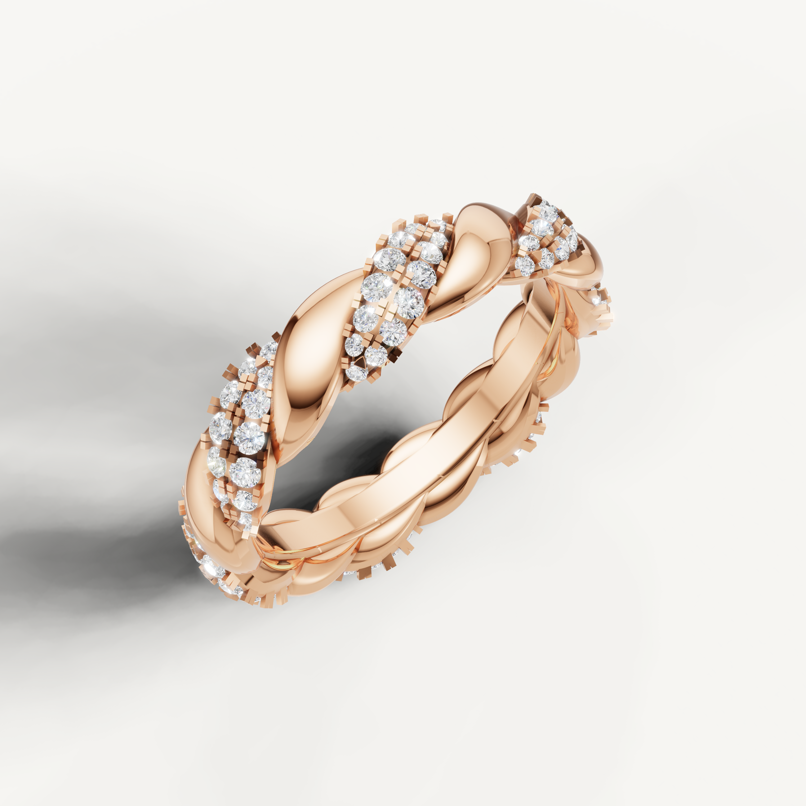 Romantic rose gold diamond wedding ring featuring a luxury twisted braid setting by Raul Diamonds