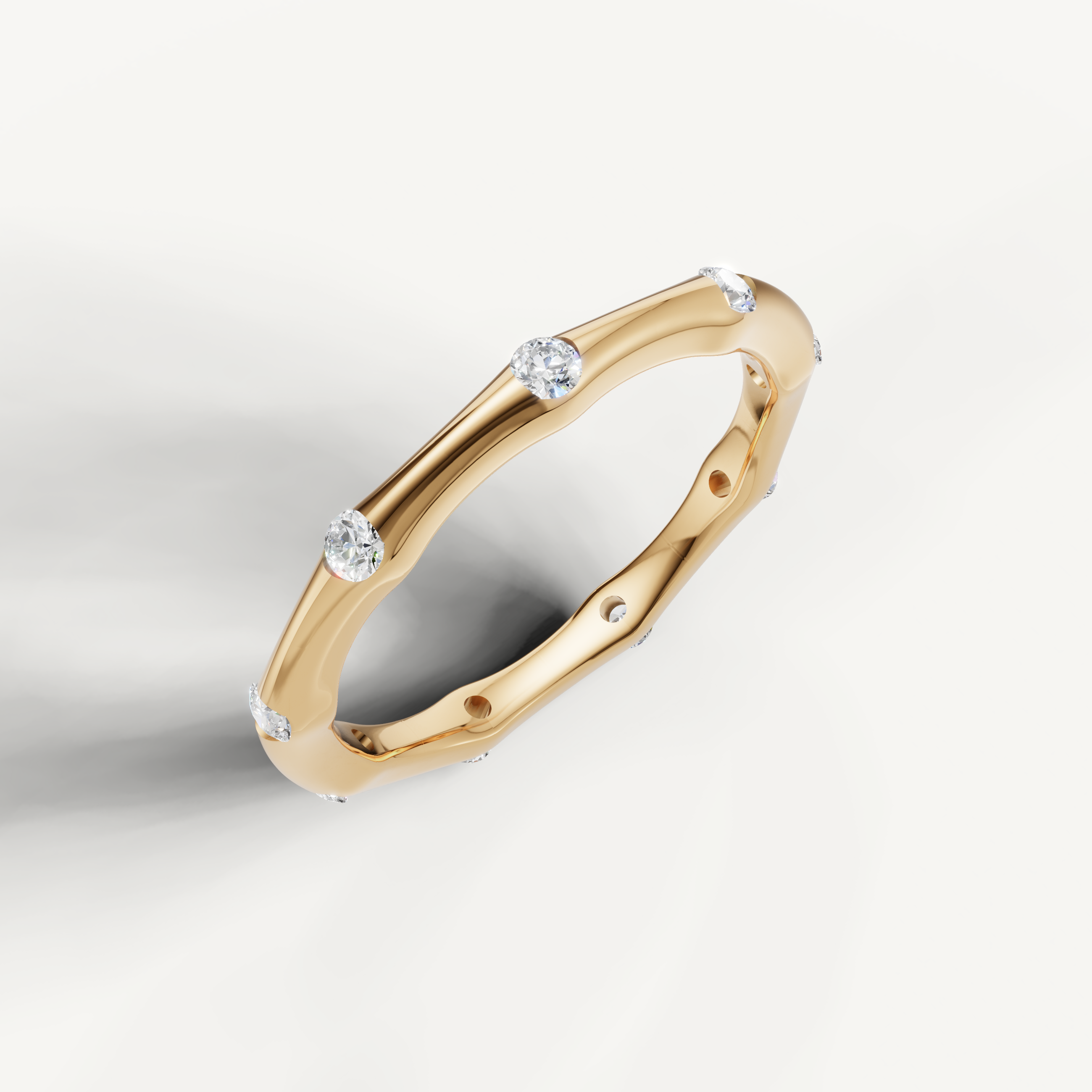 Elegant yellow gold floating diamond wedding ring by Raul Diamonds featuring a sleek curved silhouette