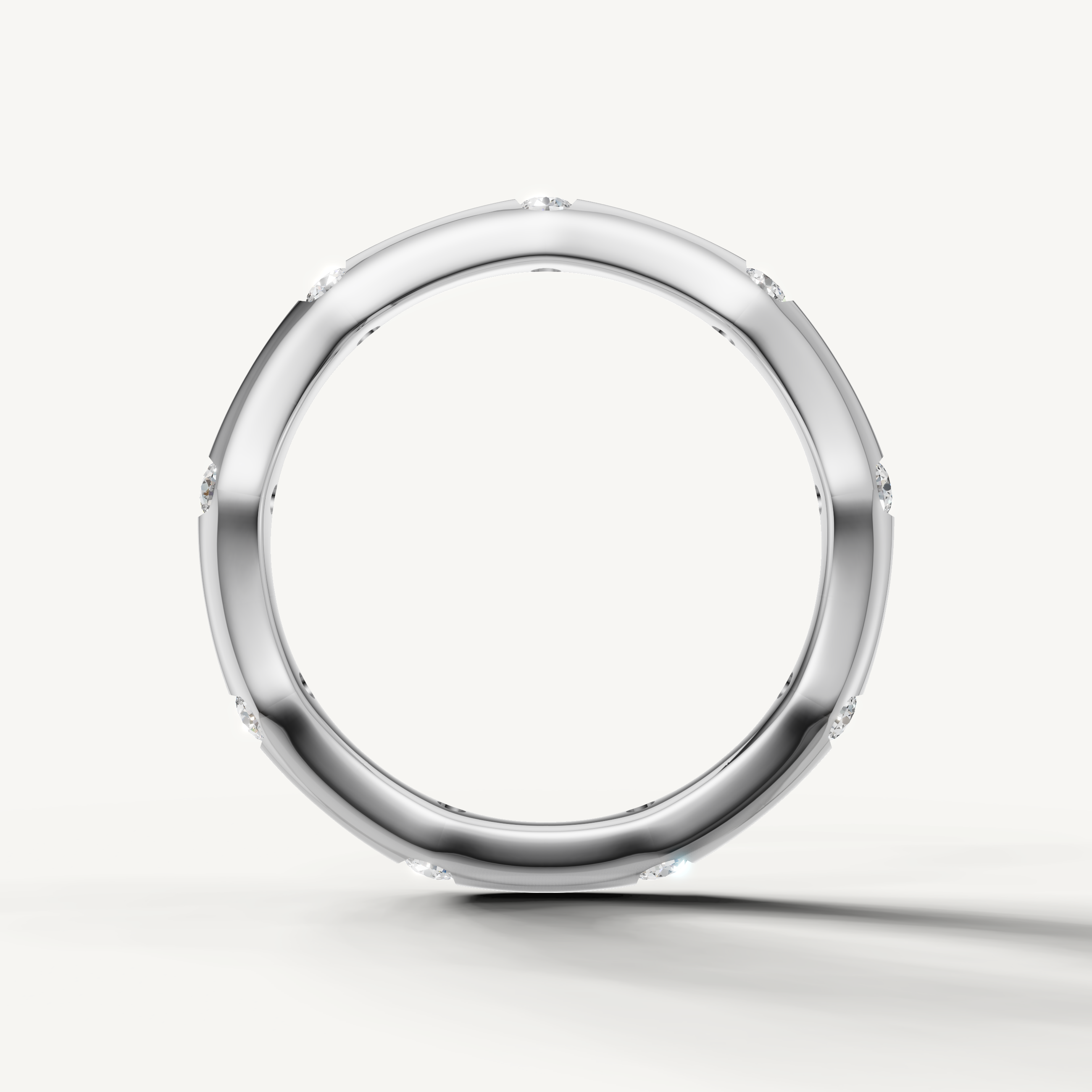 Modern white gold contour wedding band with bezel set diamonds handcrafted by Raul Diamonds