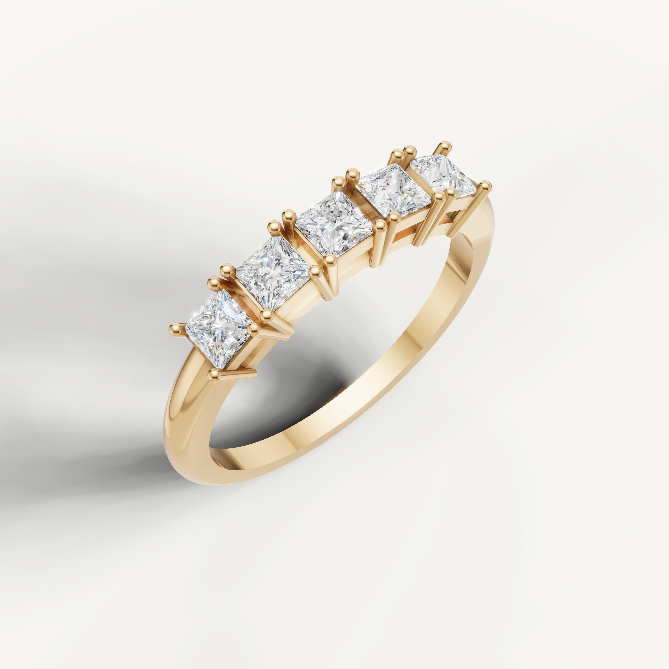 Elegant yellow gold wedding band by Raul Diamonds featuring princess cut diamonds