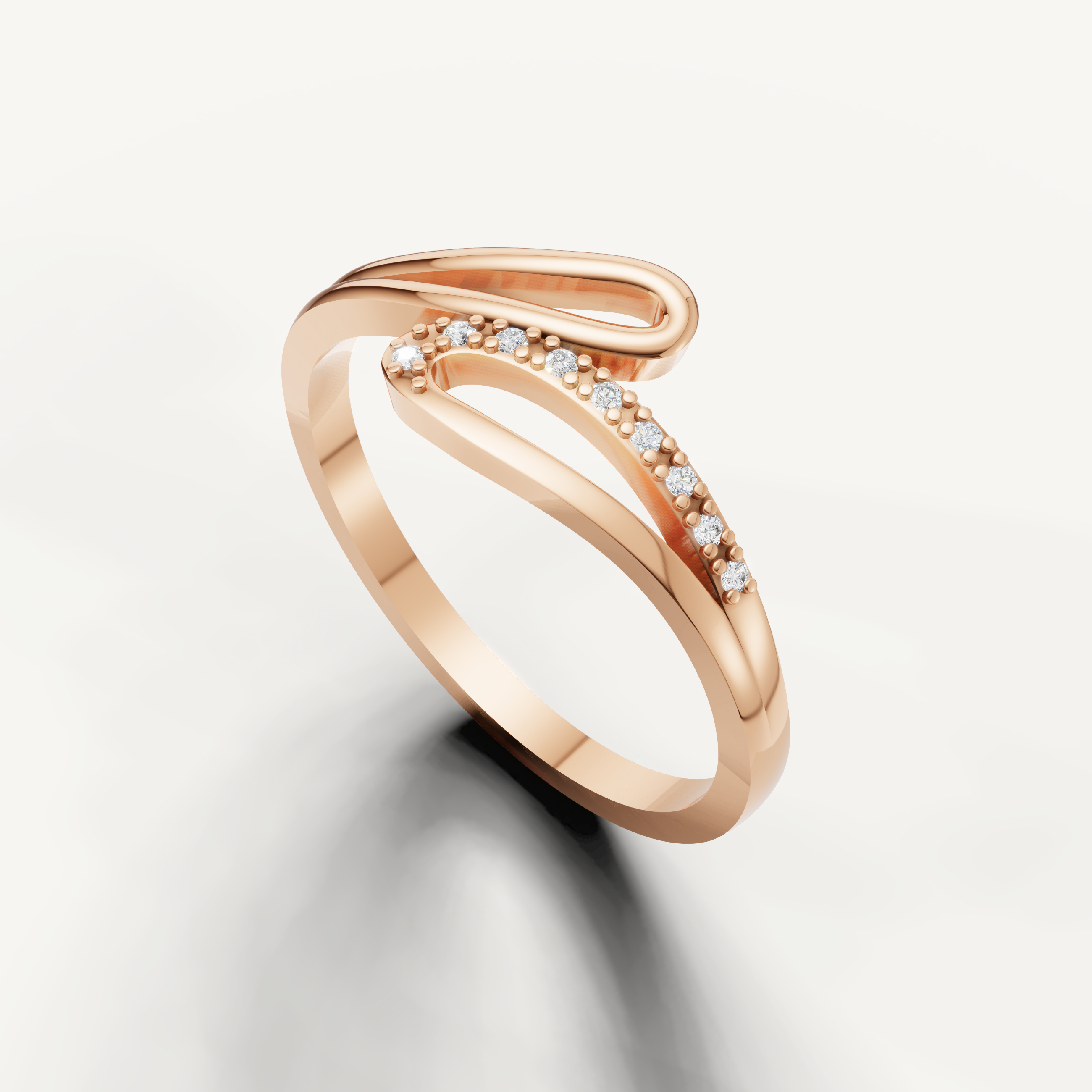 Designer rose gold wedding band featuring curved diamond detailing from Raul Diamonds