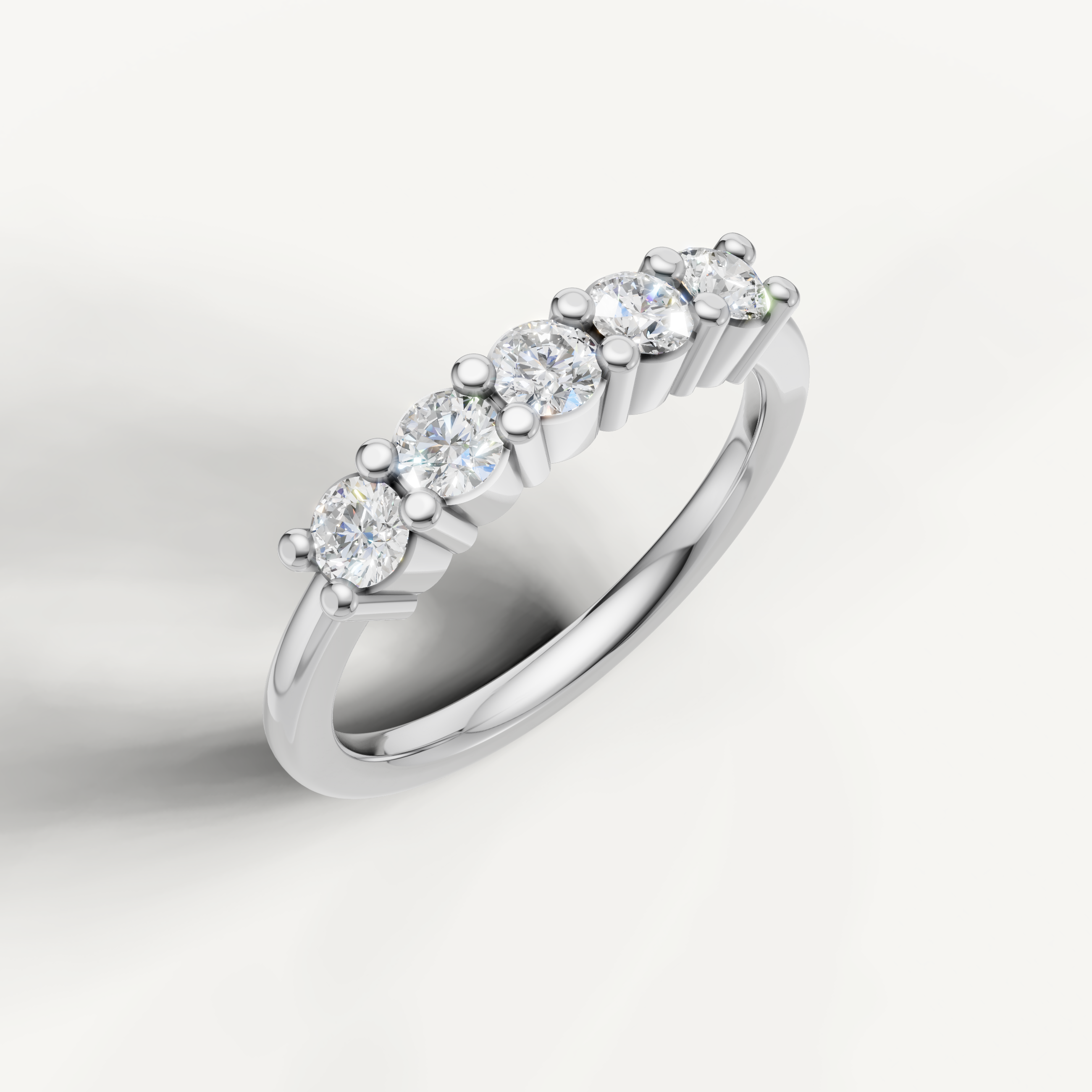 Modern white gold shared prong diamond wedding band by Raul Diamonds