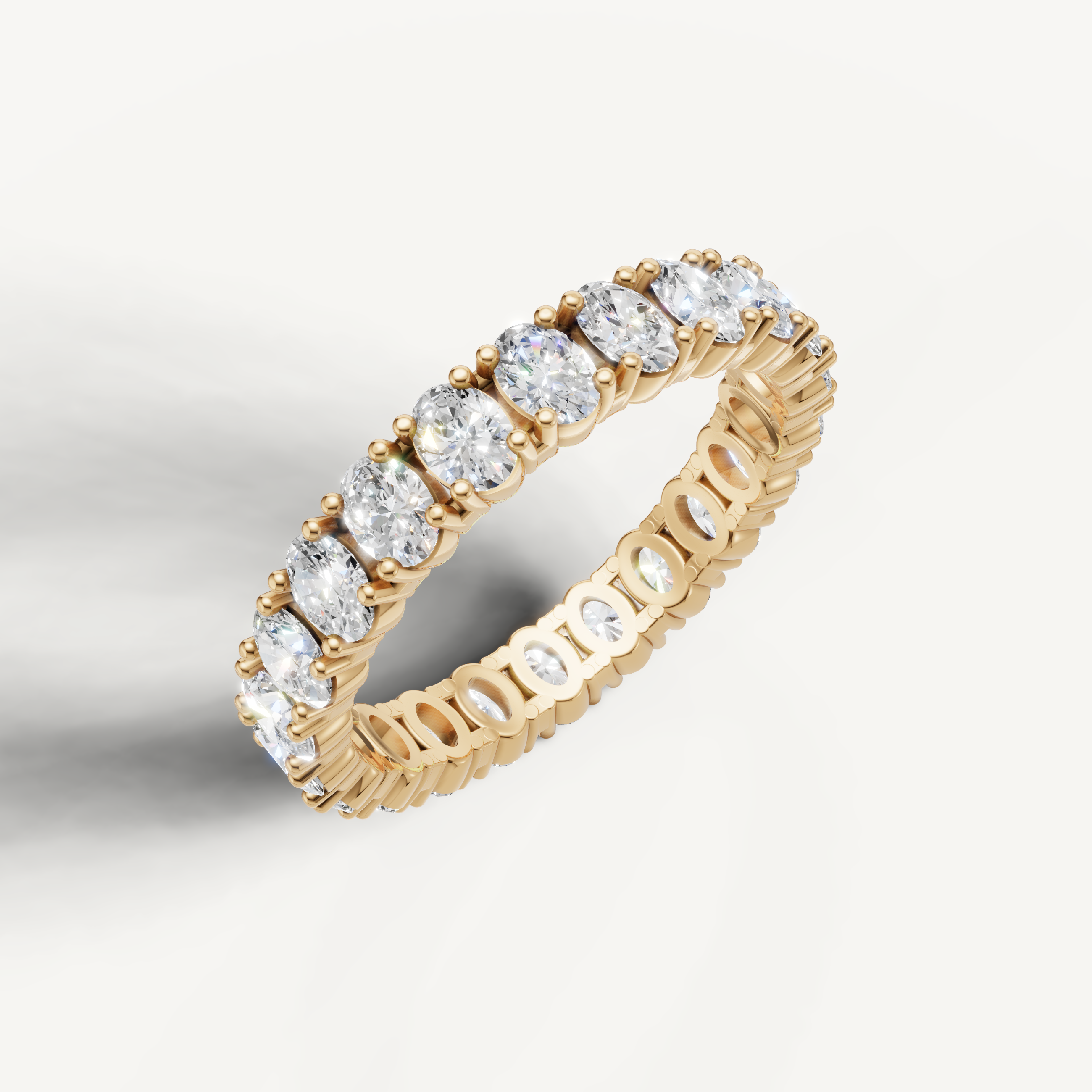 Elegant yellow gold oval cut diamond wedding band for women by Raul Diamonds