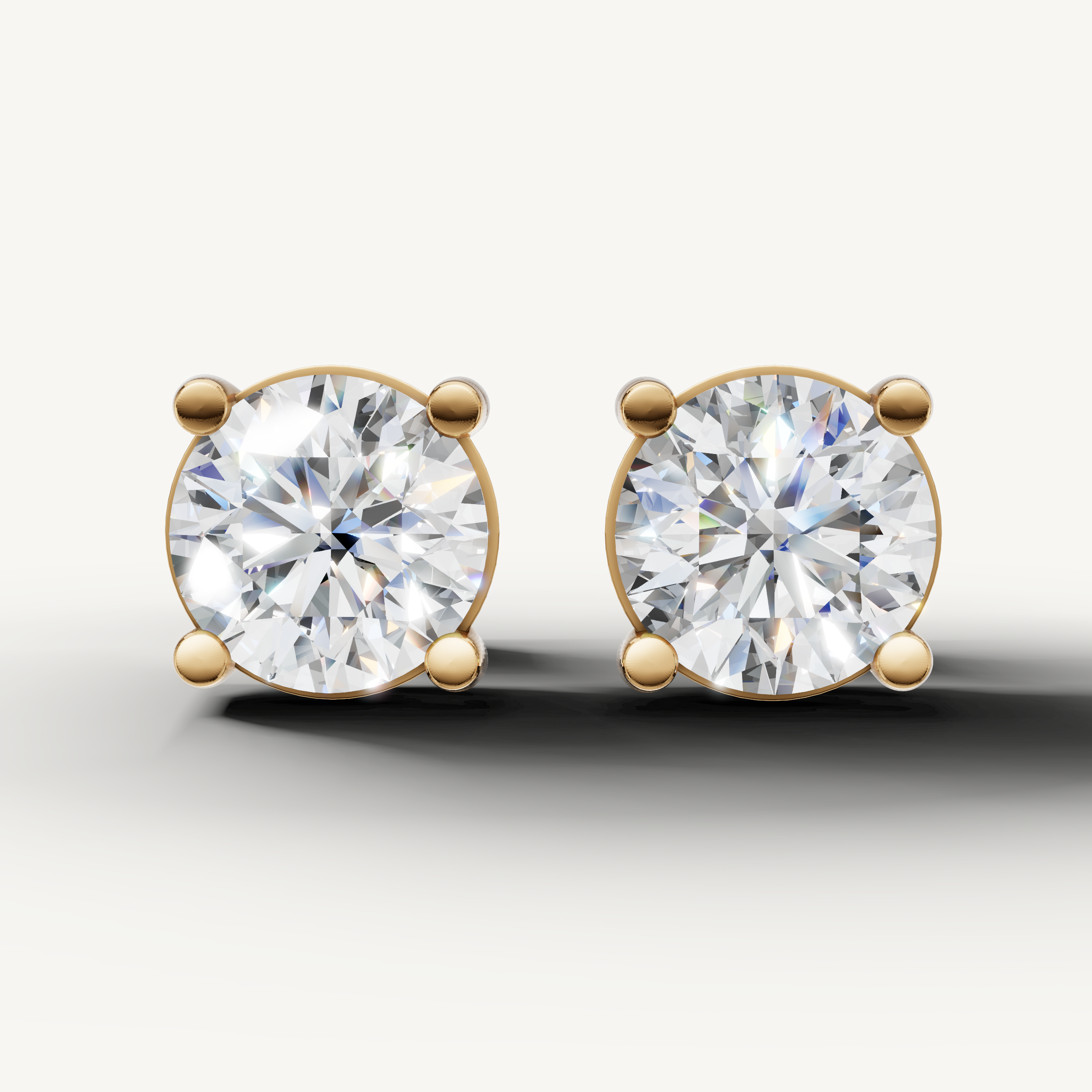 Raul Diamonds yellow gold round diamond stud earrings with timeless solitaire luxury design