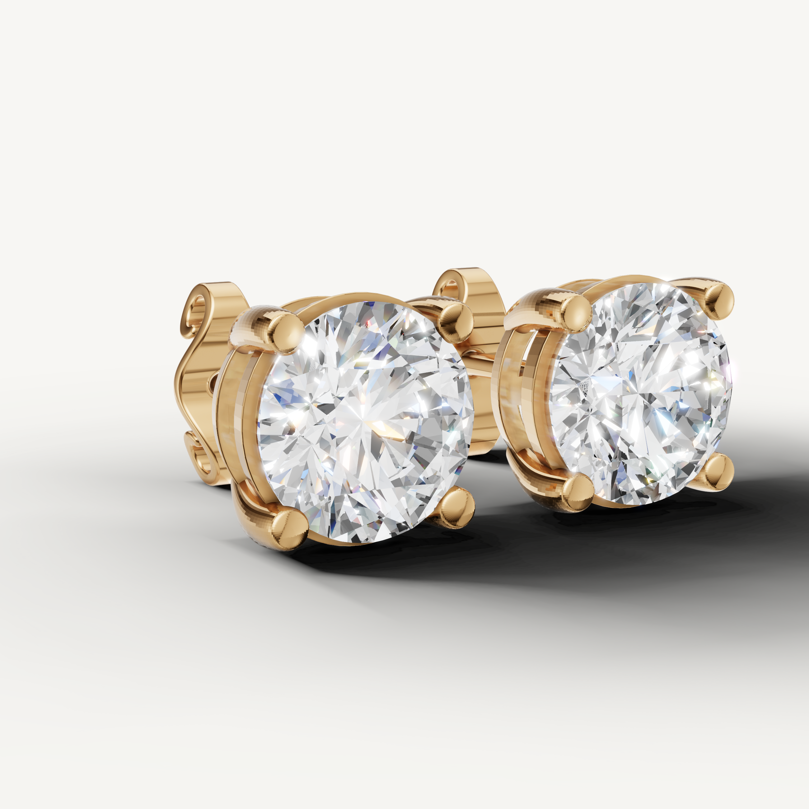 Luxury yellow gold solitaire diamond earrings for women with brilliant round cut sparkle by Raul Diamonds