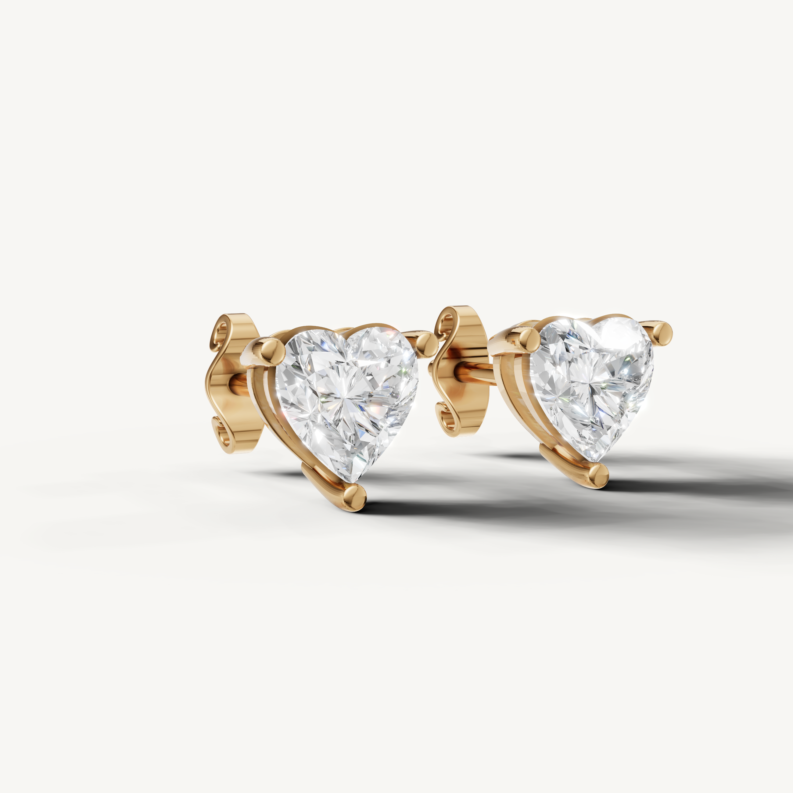 Luxury yellow gold heart cut diamond stud earrings for women with timeless elegance by Raul Diamonds