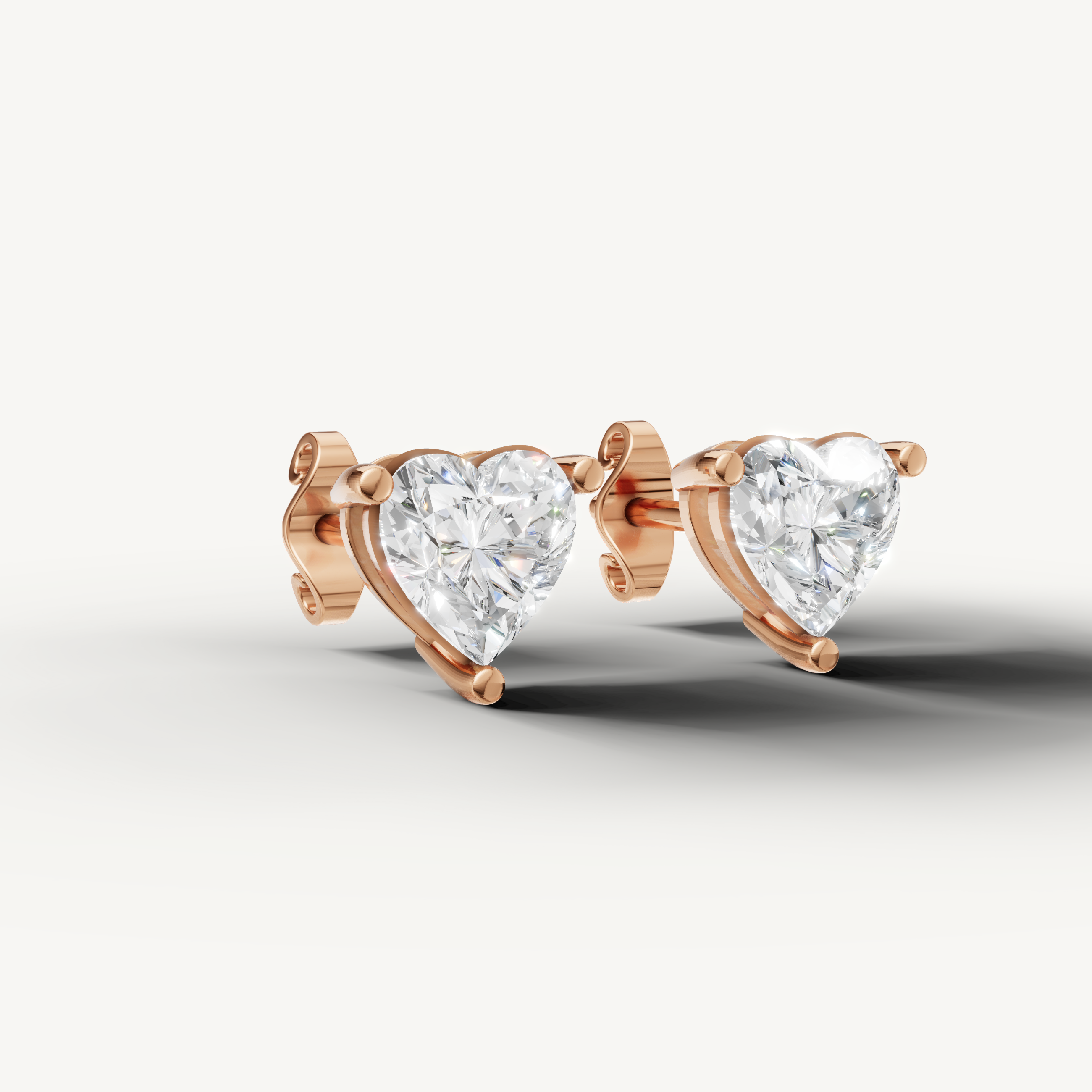 Luxury rose gold heart cut diamond stud earrings for women with timeless sparkle by Raul Diamonds