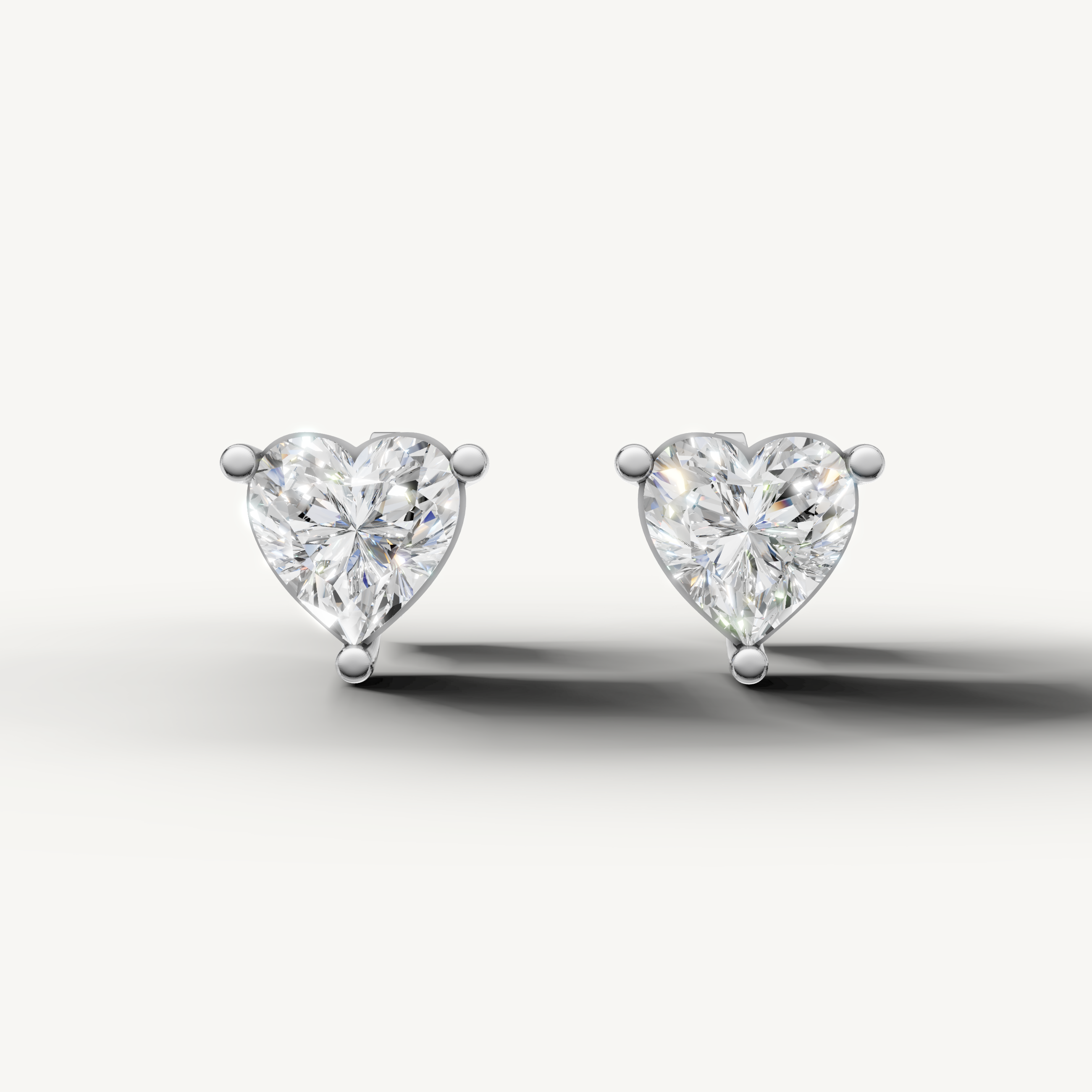 Raul Diamonds white gold heart diamond stud earrings with brilliant solitaire sparkle