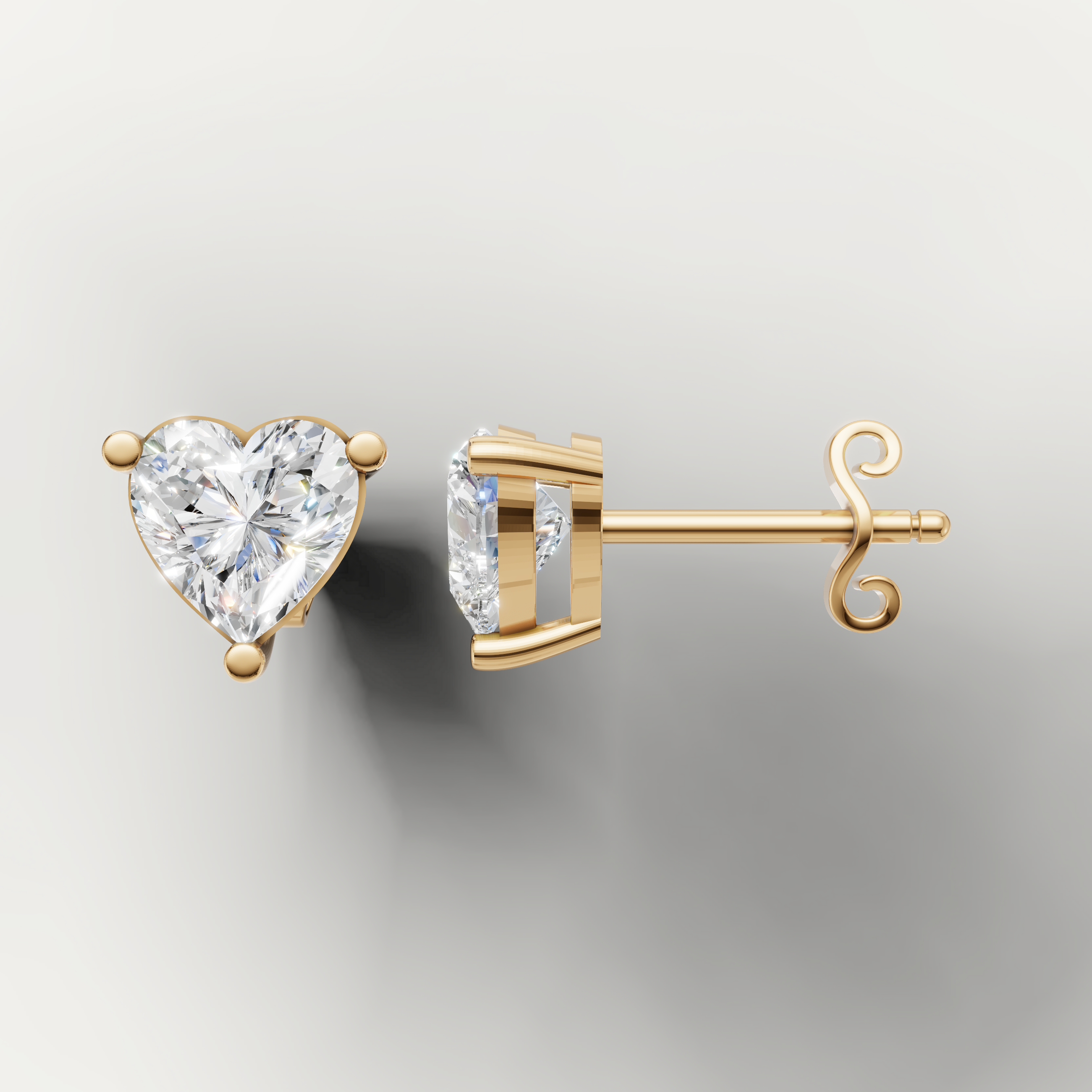 Yellow gold heart shape diamond earrings by Raul Diamonds featuring romantic luxury styling