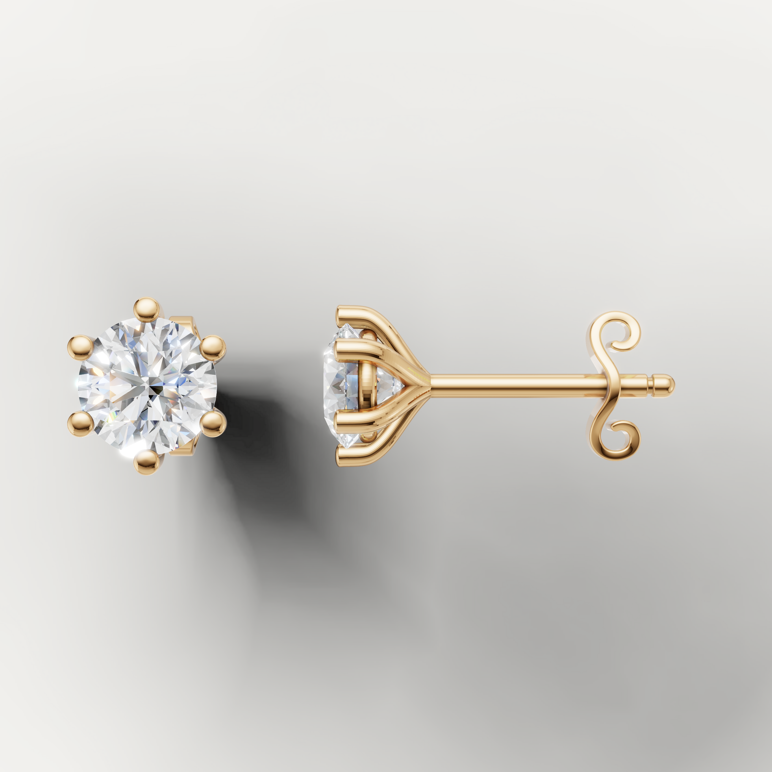 Yellow gold solitaire diamond stud earrings by Raul Diamonds featuring timeless elegance and brilliance