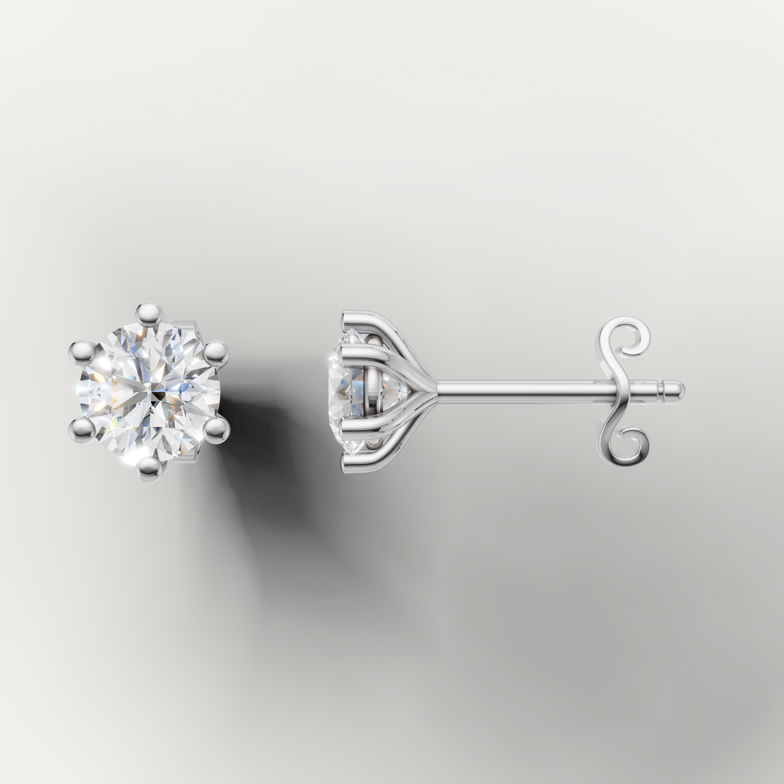 White gold solitaire diamond stud earrings by Raul Diamonds featuring timeless round brilliance