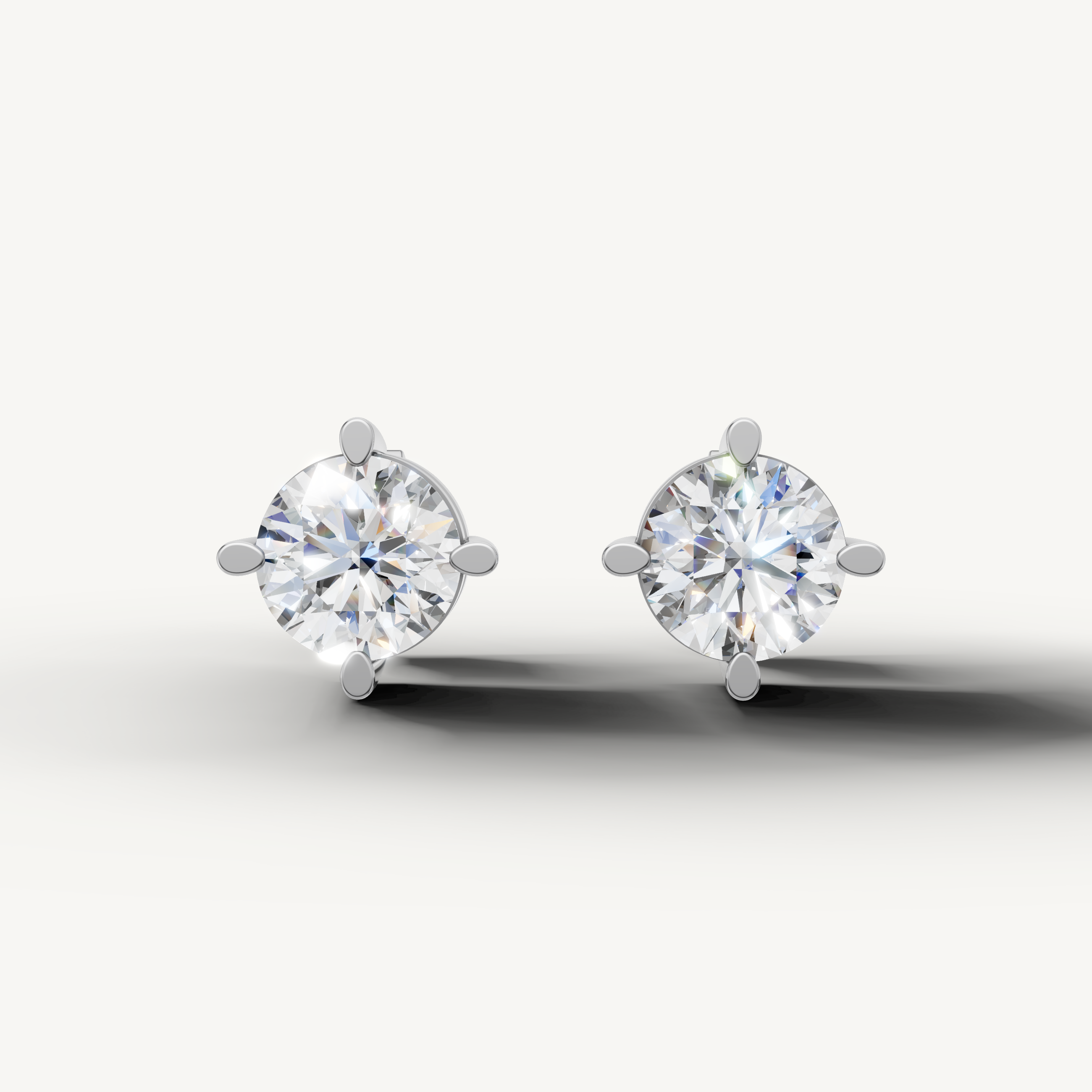 Raul Diamonds white gold round diamond stud earrings with classic four prong solitaire setting
