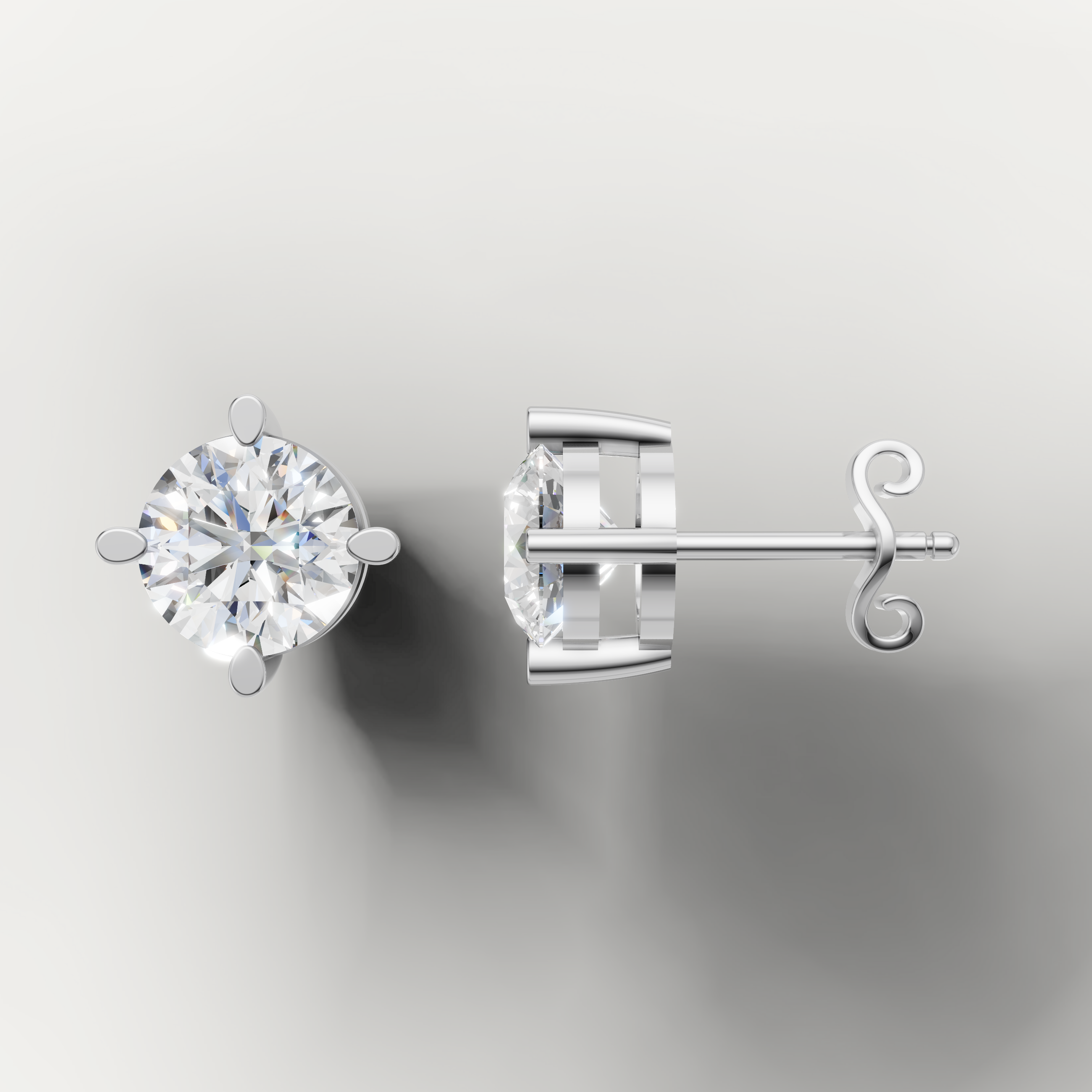 White gold solitaire diamond stud earrings by Raul Diamonds featuring timeless round brilliance