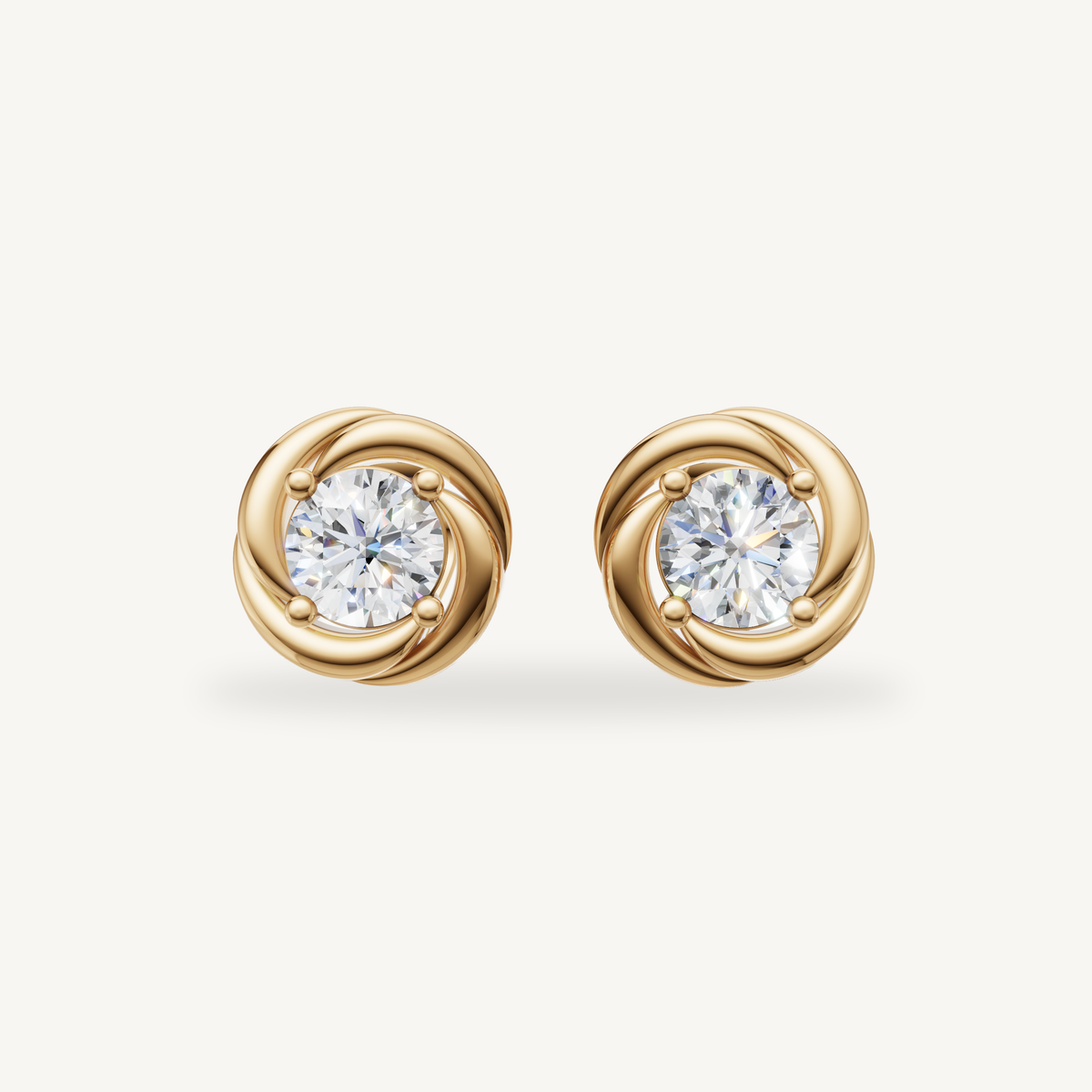 Raul Diamonds yellow gold swirl halo diamond stud earrings with round brilliant center stones