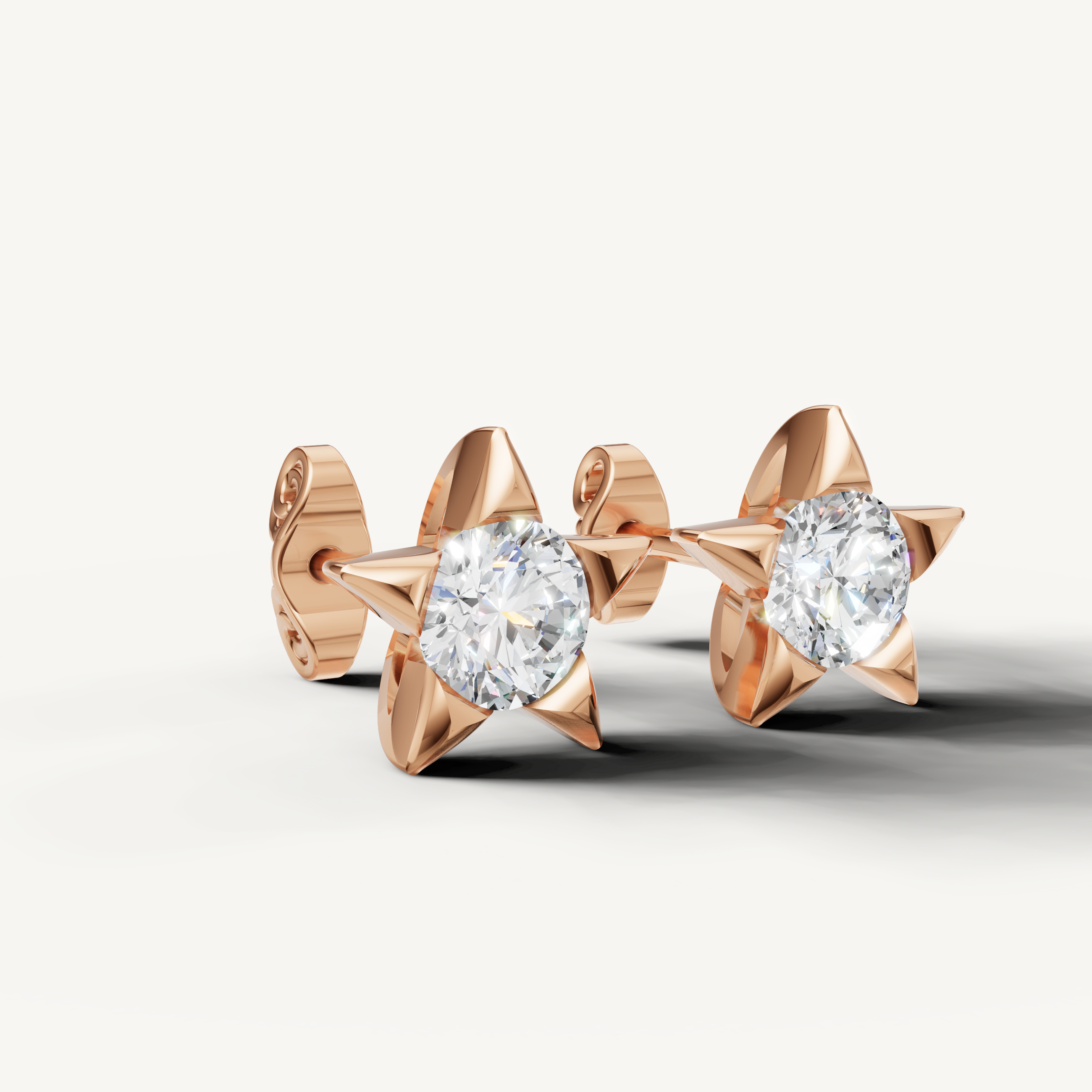 Rose gold celestial diamond star earrings by Raul Diamonds with elegant modern style