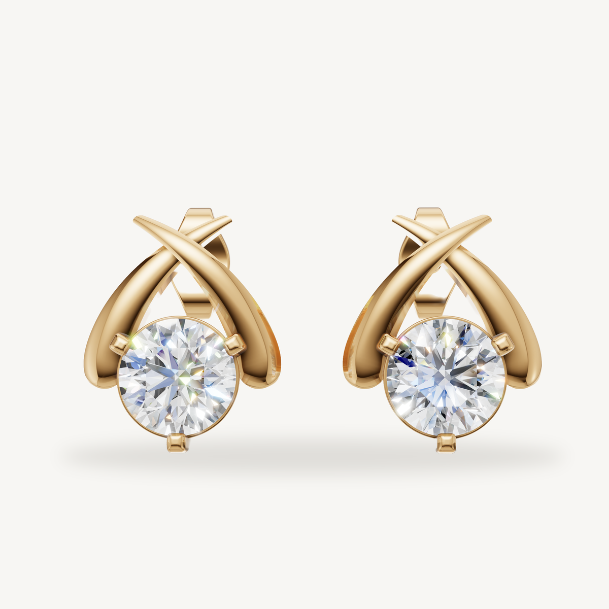 Raul Diamonds yellow gold crossover diamond stud earrings with modern luxury sparkle