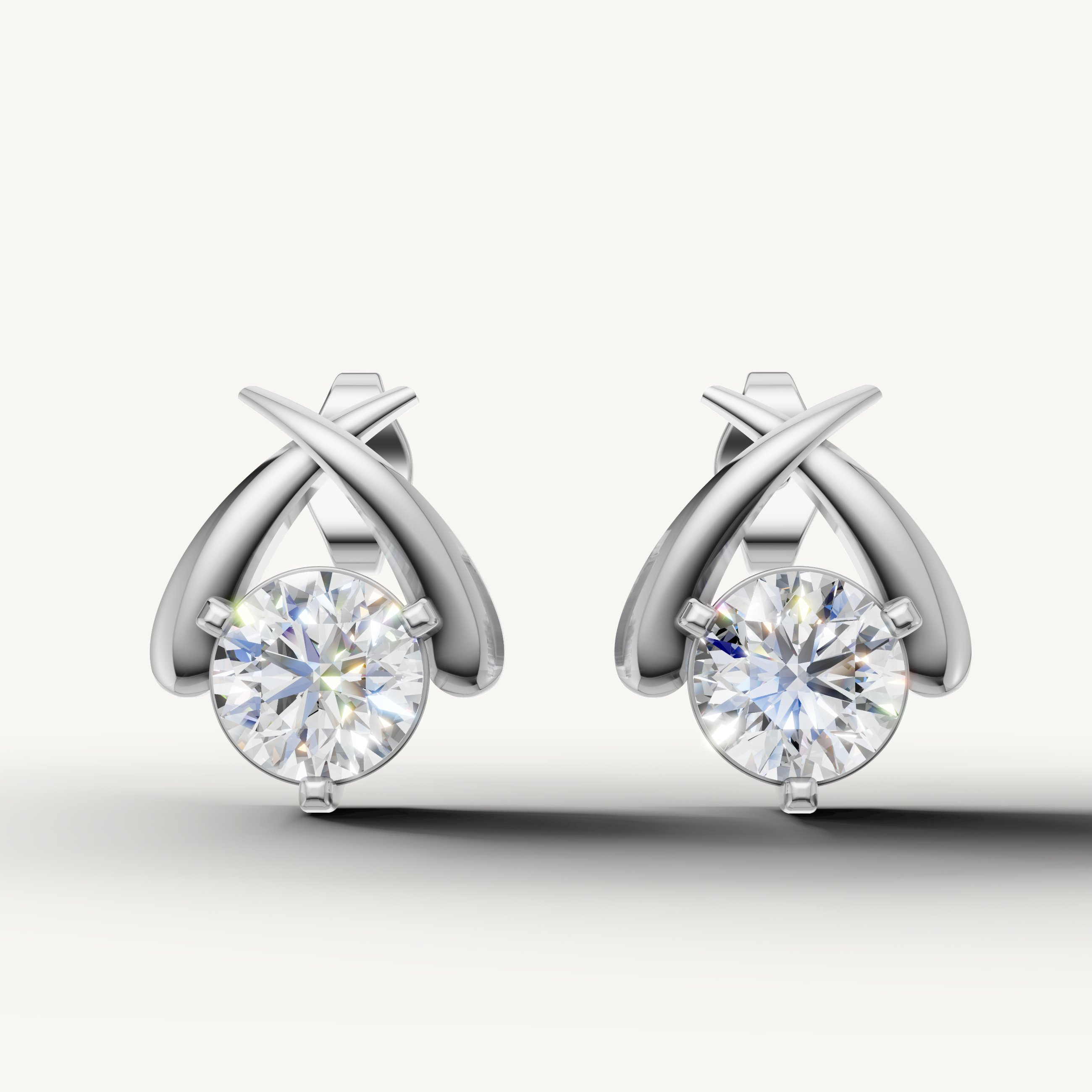 White gold round diamond crossover earrings by Raul Diamonds with brilliant shine