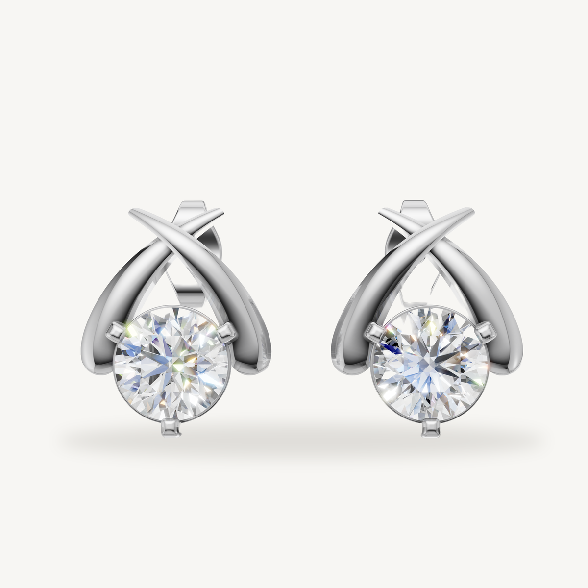 White gold round diamond crossover earrings by Raul Diamonds with brilliant shine