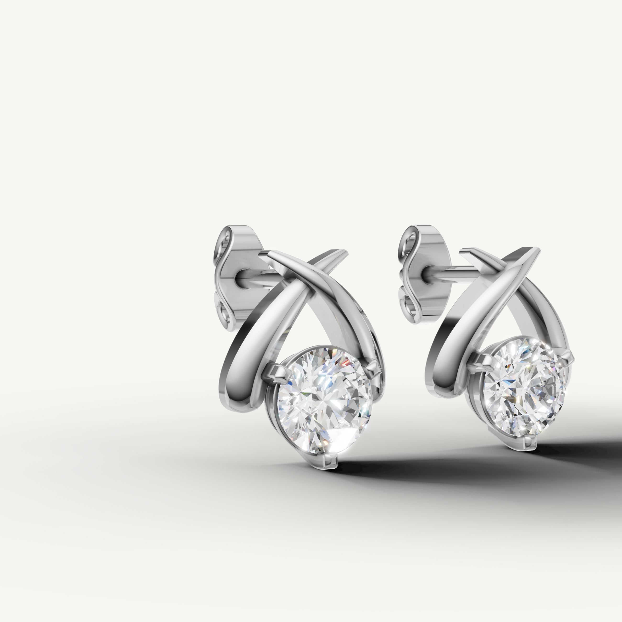 Elegant white gold criss cross diamond earrings with radiant brilliance by Raul Diamonds