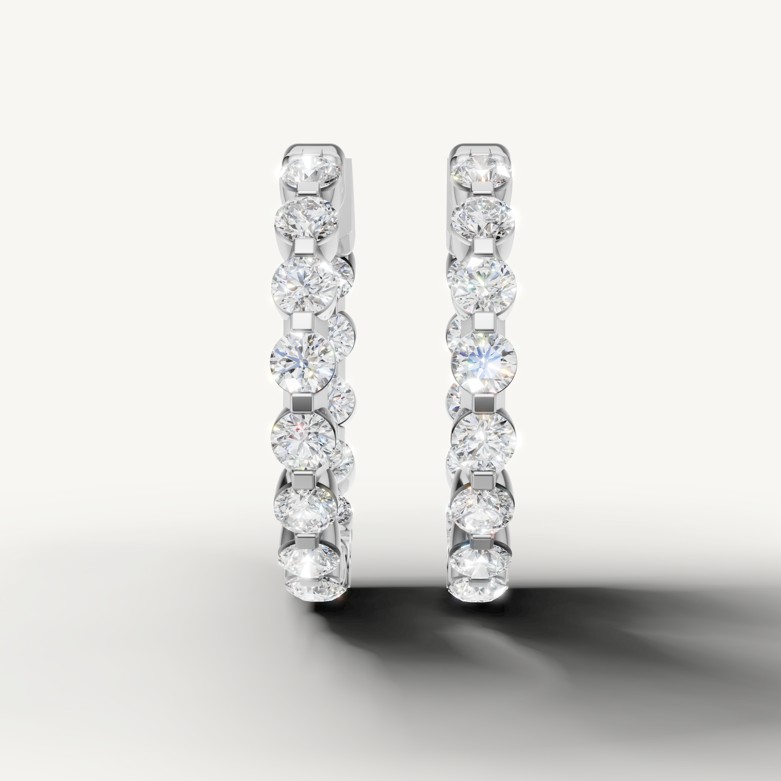 Raul Diamonds white gold diamond hoop earrings with round brilliant diamonds