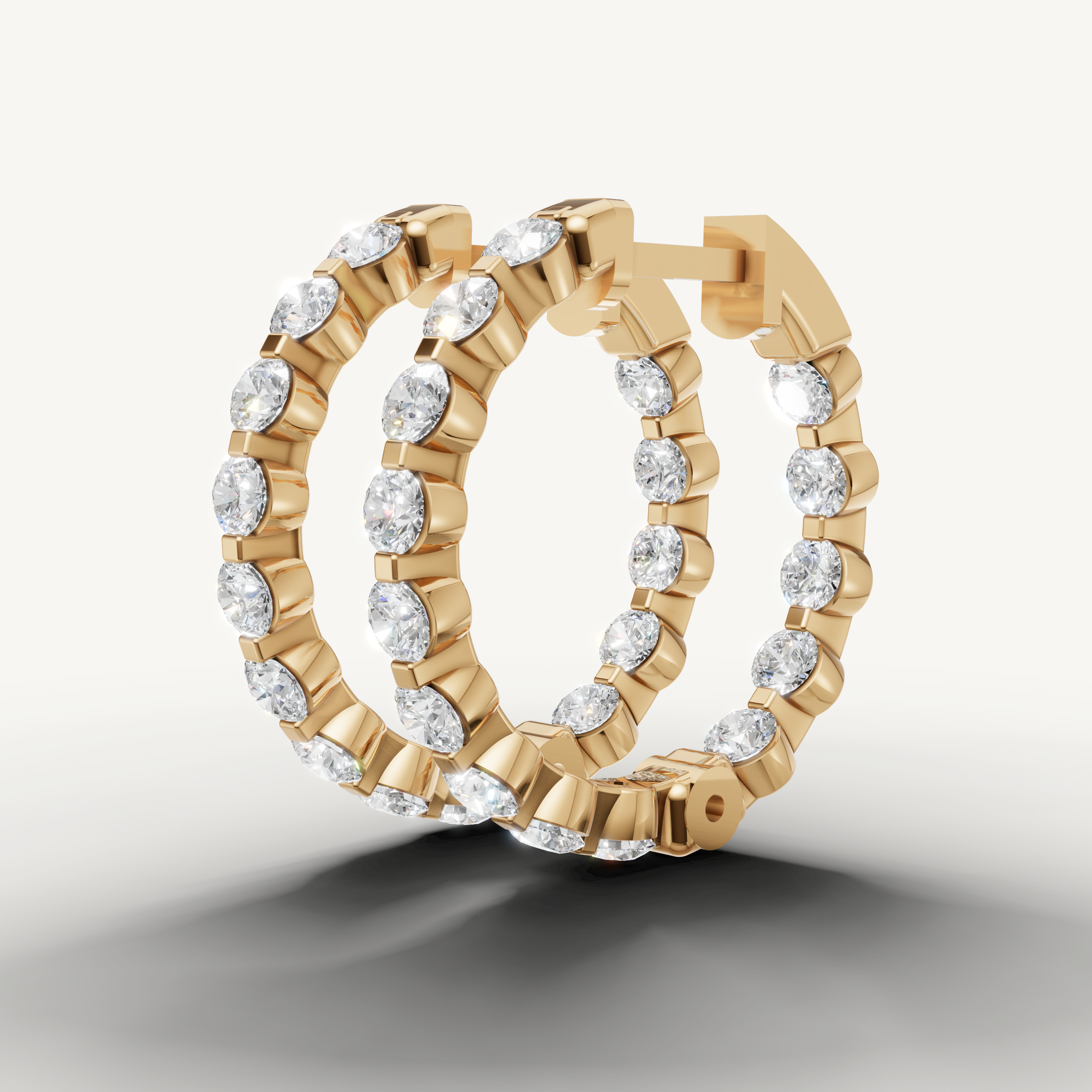 Elegant yellow gold diamond hoop earrings with sparkling brilliance by Raul Diamonds