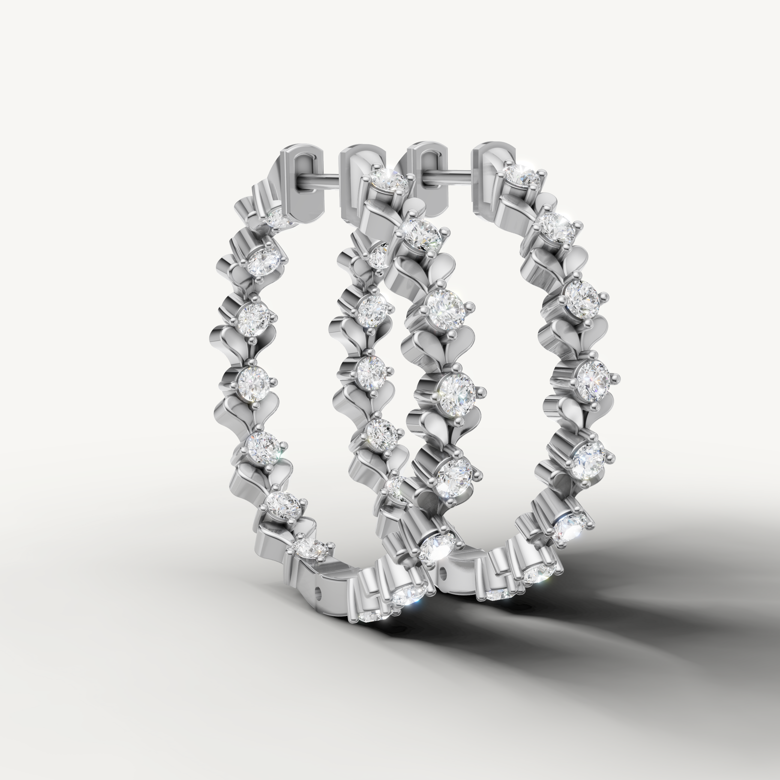 White gold diamond hoop earrings by Raul Diamonds with luxury floral elegance