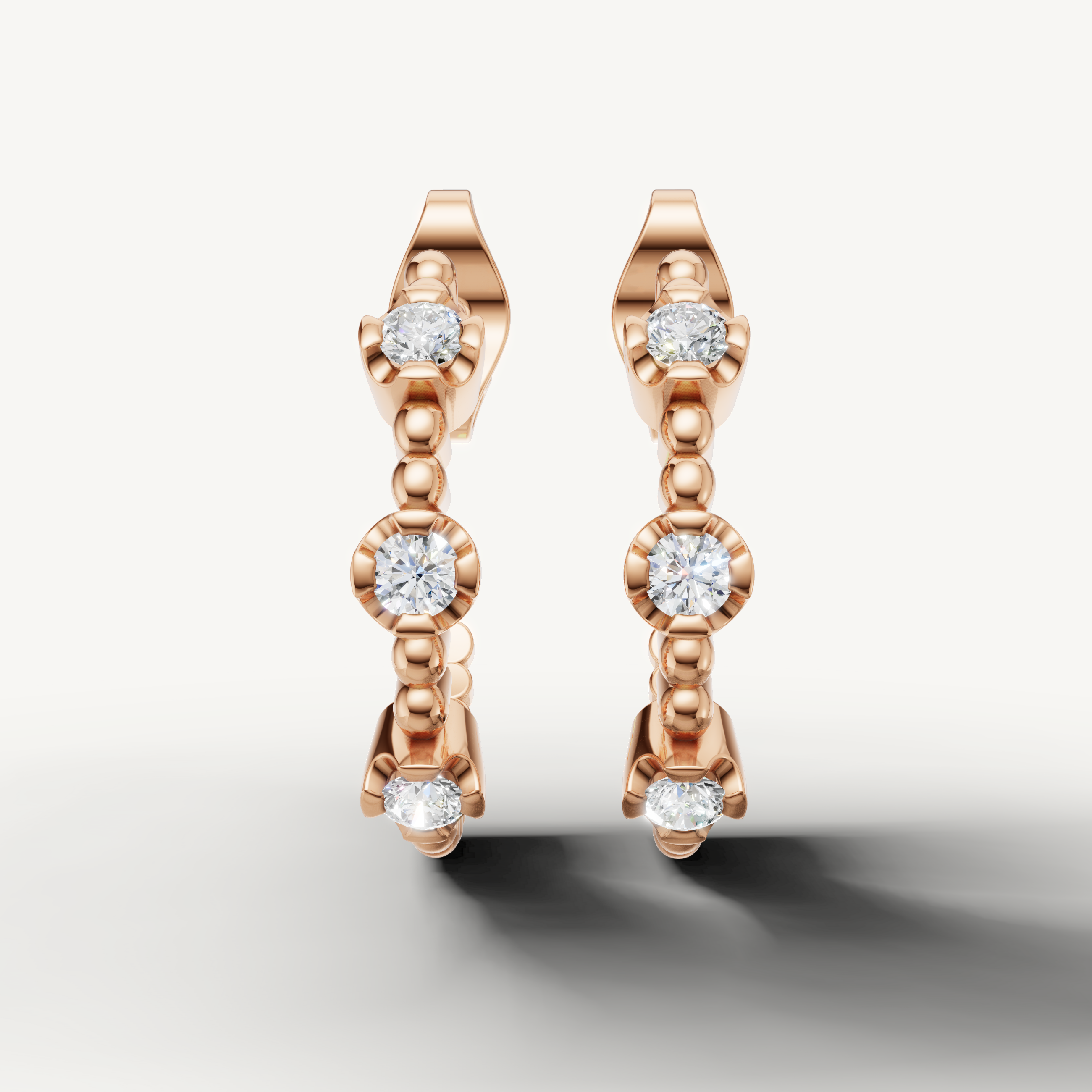 Raul Diamonds rose gold diamond hoop earrings with bezel set round diamonds
