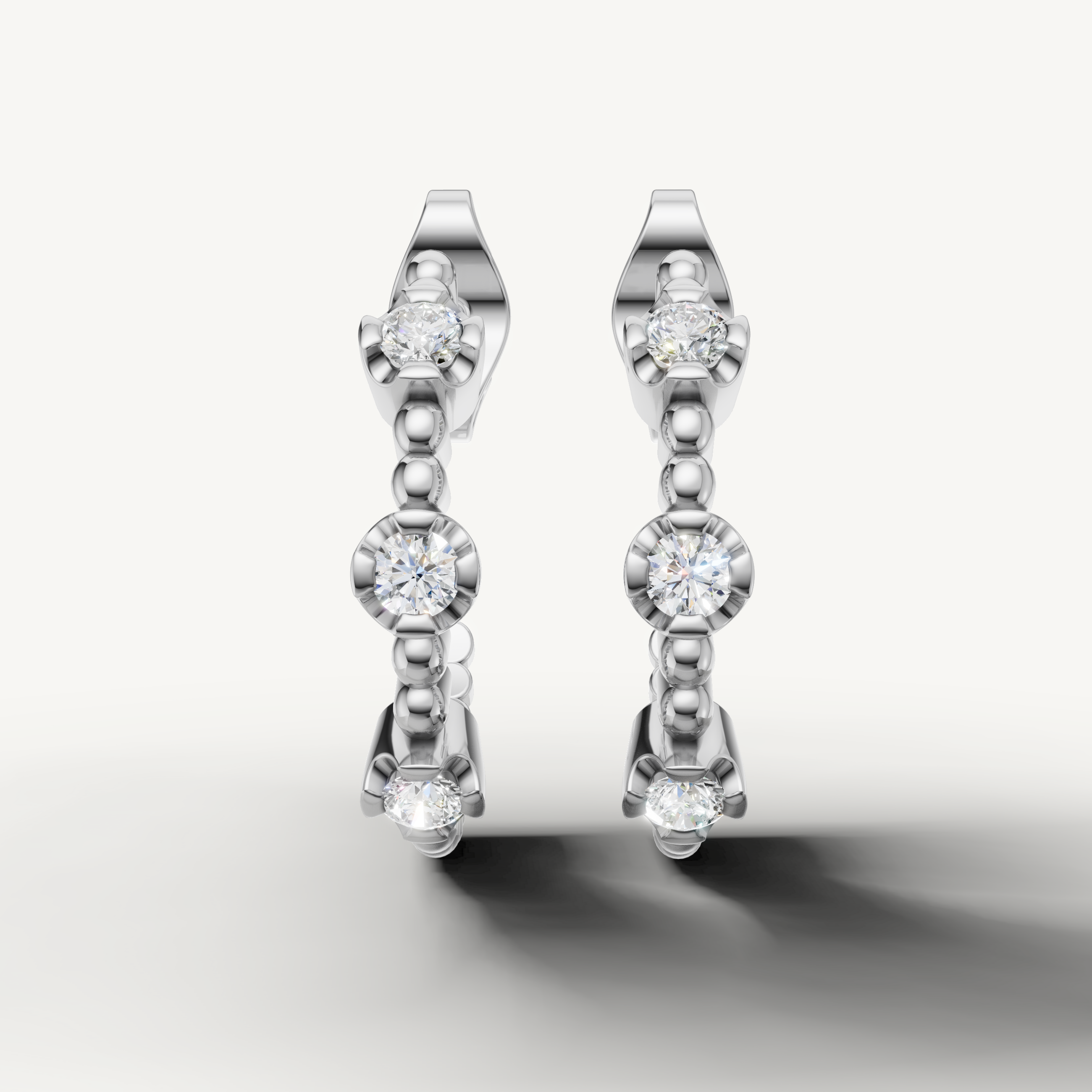 Luxury white gold drop earrings with bezel set diamond accents