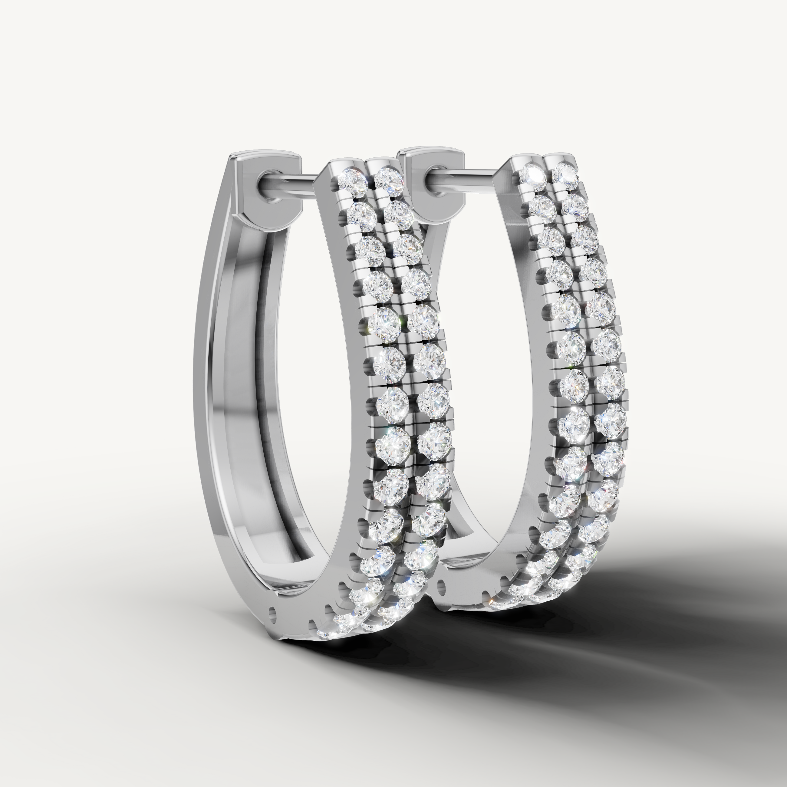 Elegant white gold diamond hoop earrings for women by Raul Diamonds