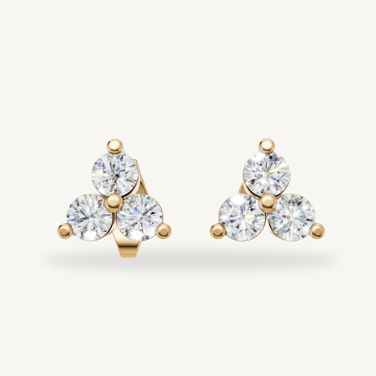 Raul Diamonds yellow gold three stone diamond stud earrings for women