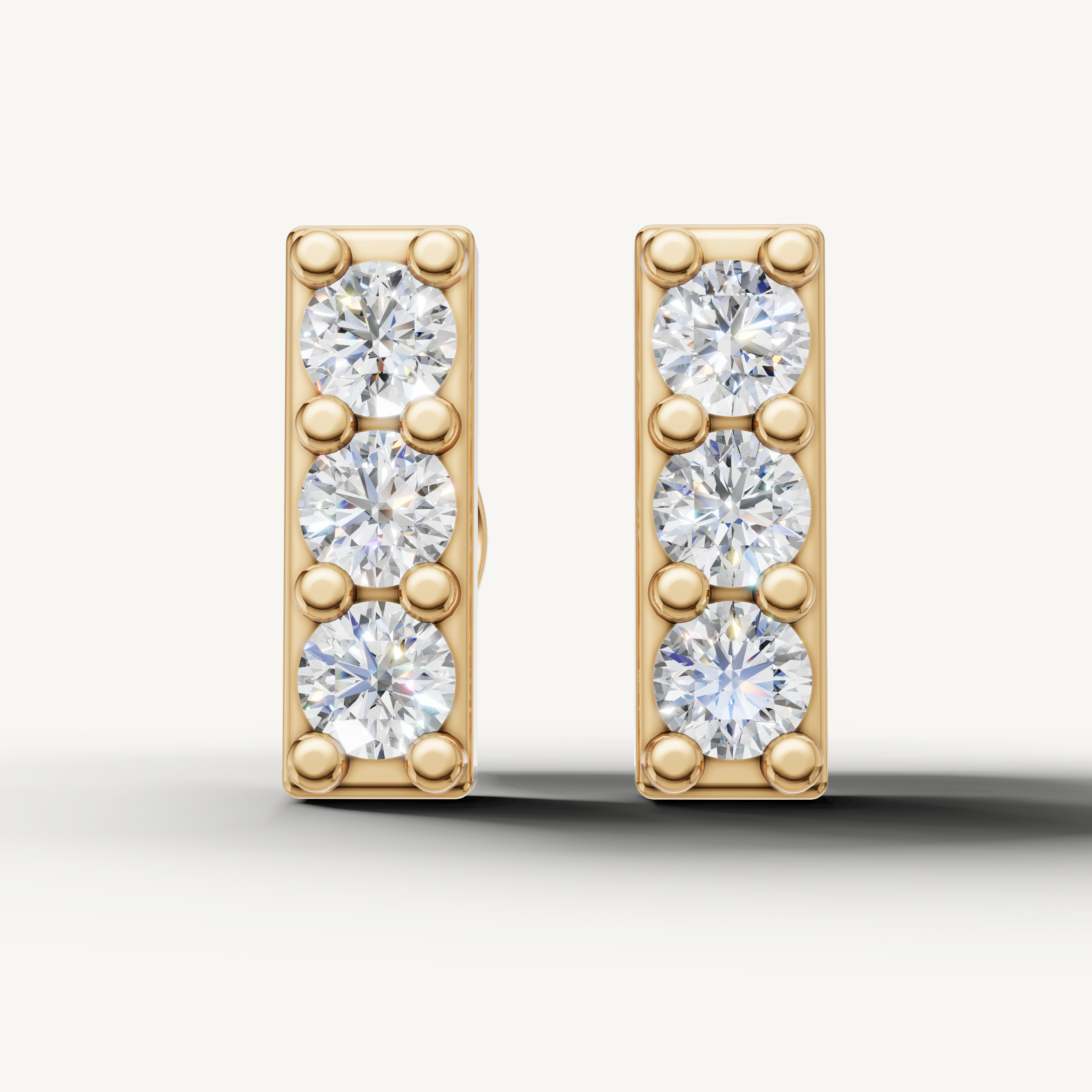 Raul Diamonds yellow gold three stone diamond bar stud earrings for women