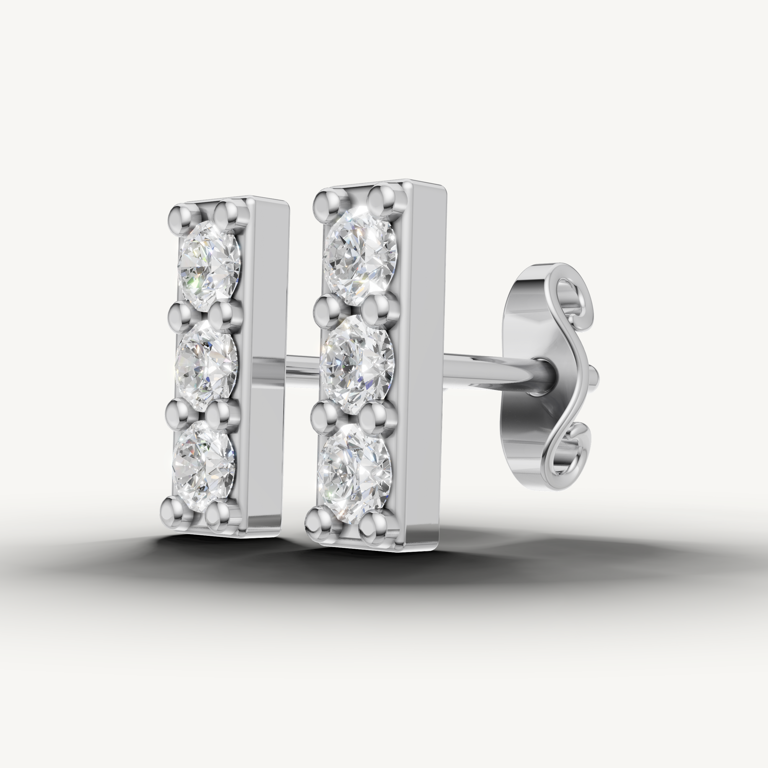 Elegant white gold triple diamond earrings handcrafted by Raul Diamonds