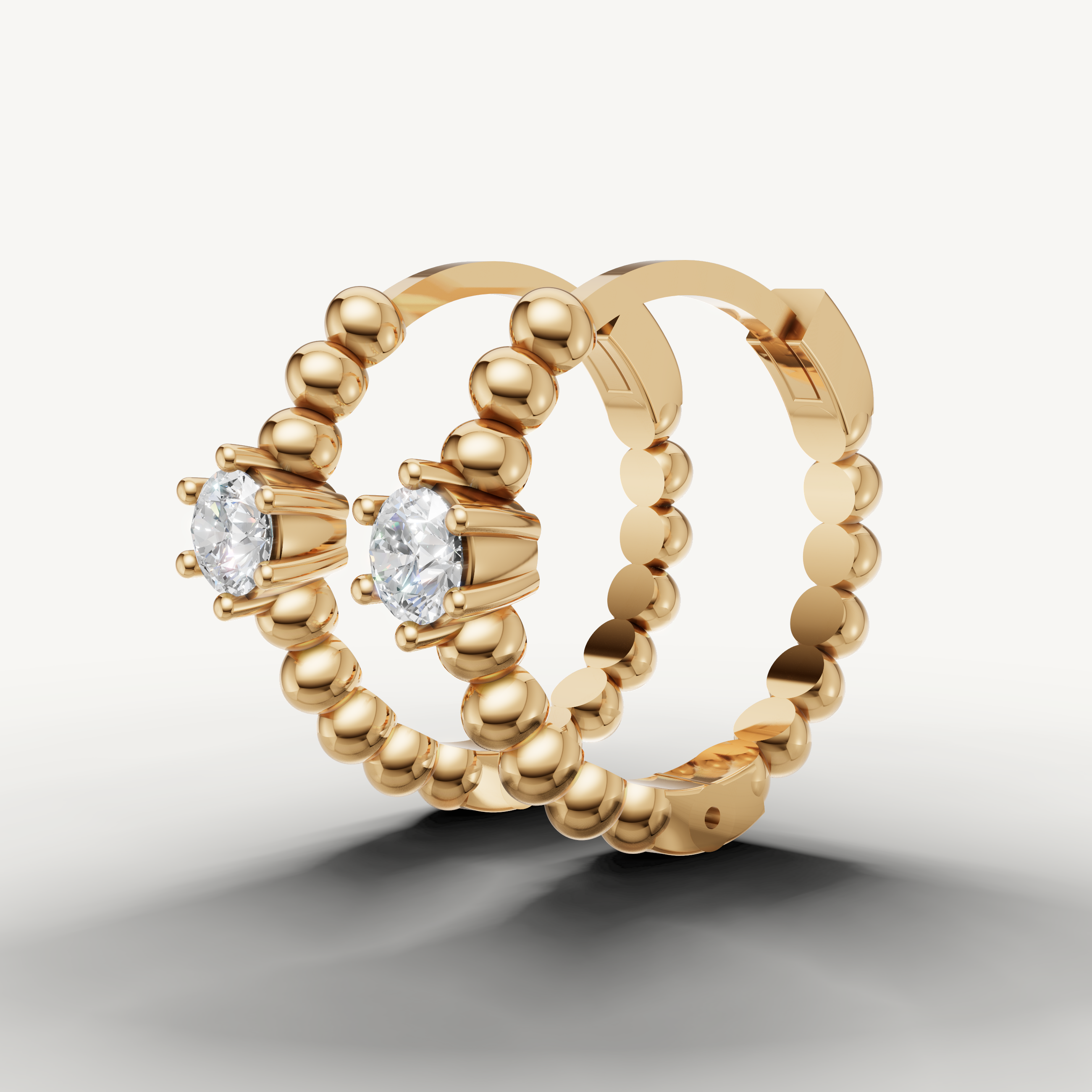 Modern yellow gold solitaire diamond hoop earrings Raul Diamonds