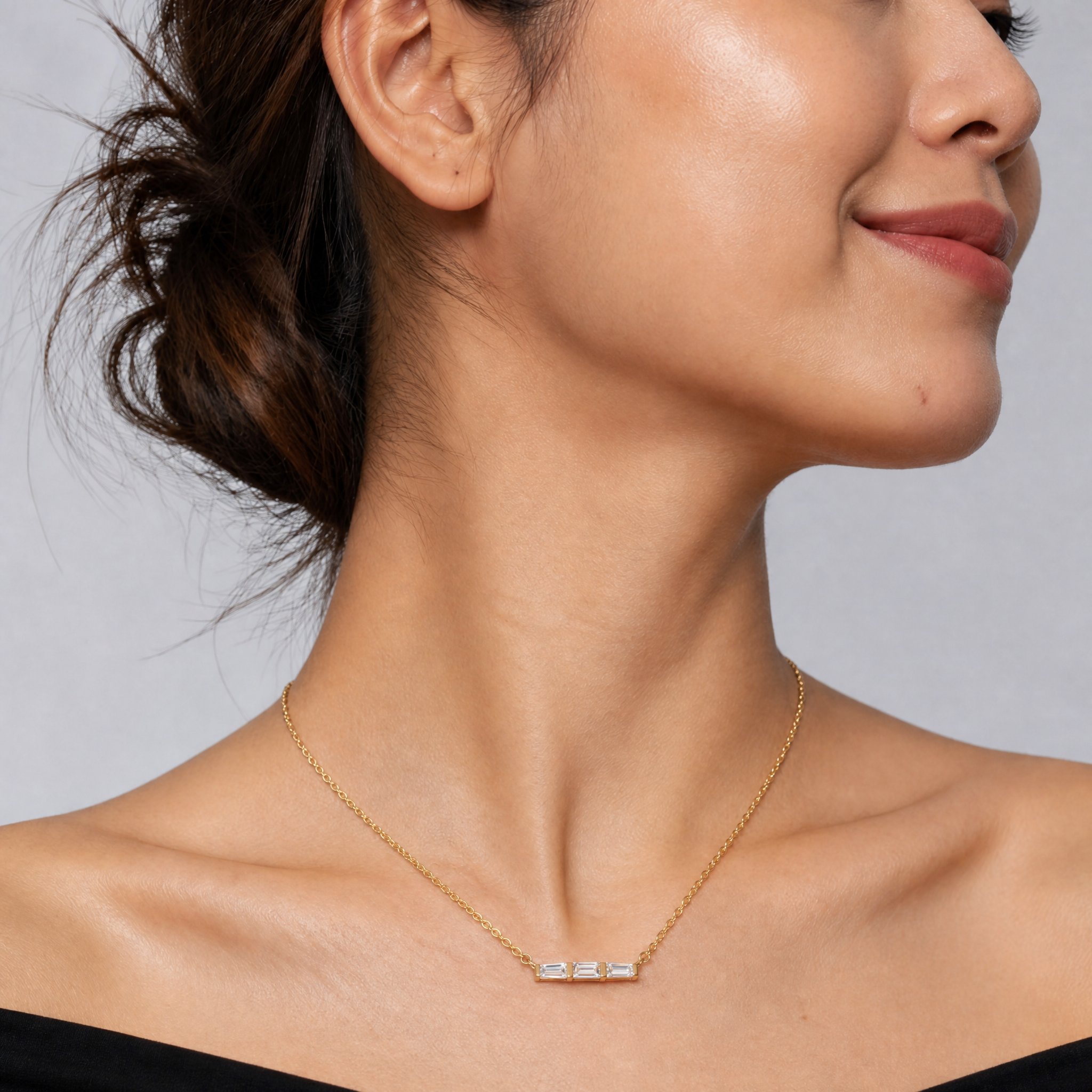 Female Model Wearing Baguette and Trillion Lab Grown Diamond Bar Necklace in 14K Gold by Raul Diamonds