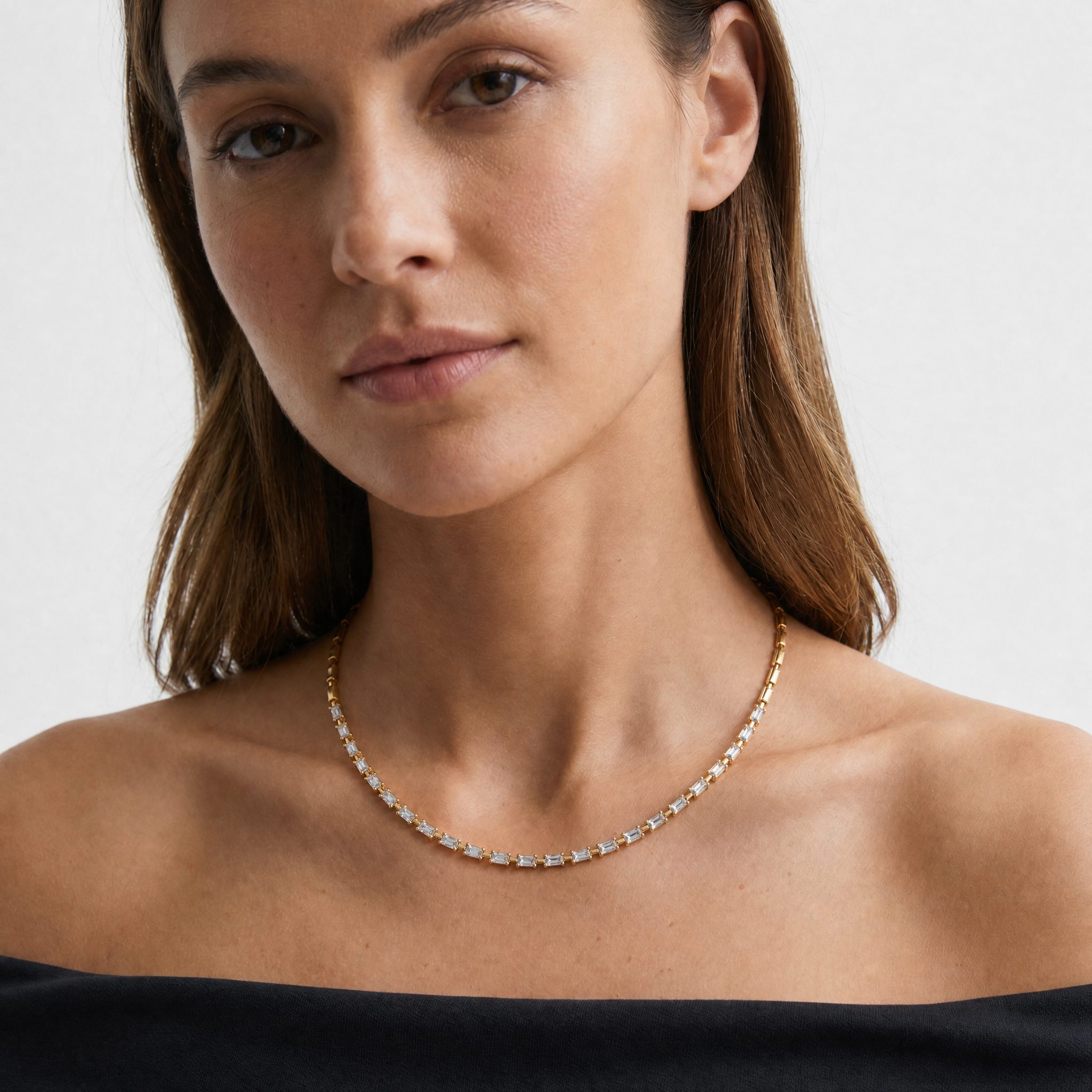 Female Model Wearing Emerald Cut Lab Grown Diamond Tennis Necklace in 14K Gold by Raul Diamonds