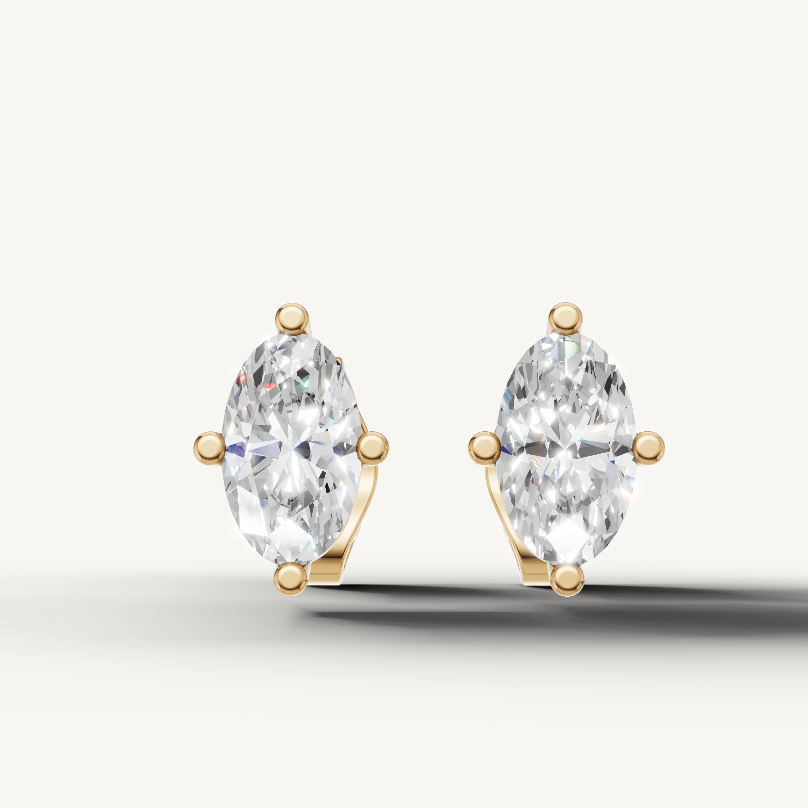 Raul Diamonds yellow gold marquise diamond stud earrings with elegant solitaire luxury design