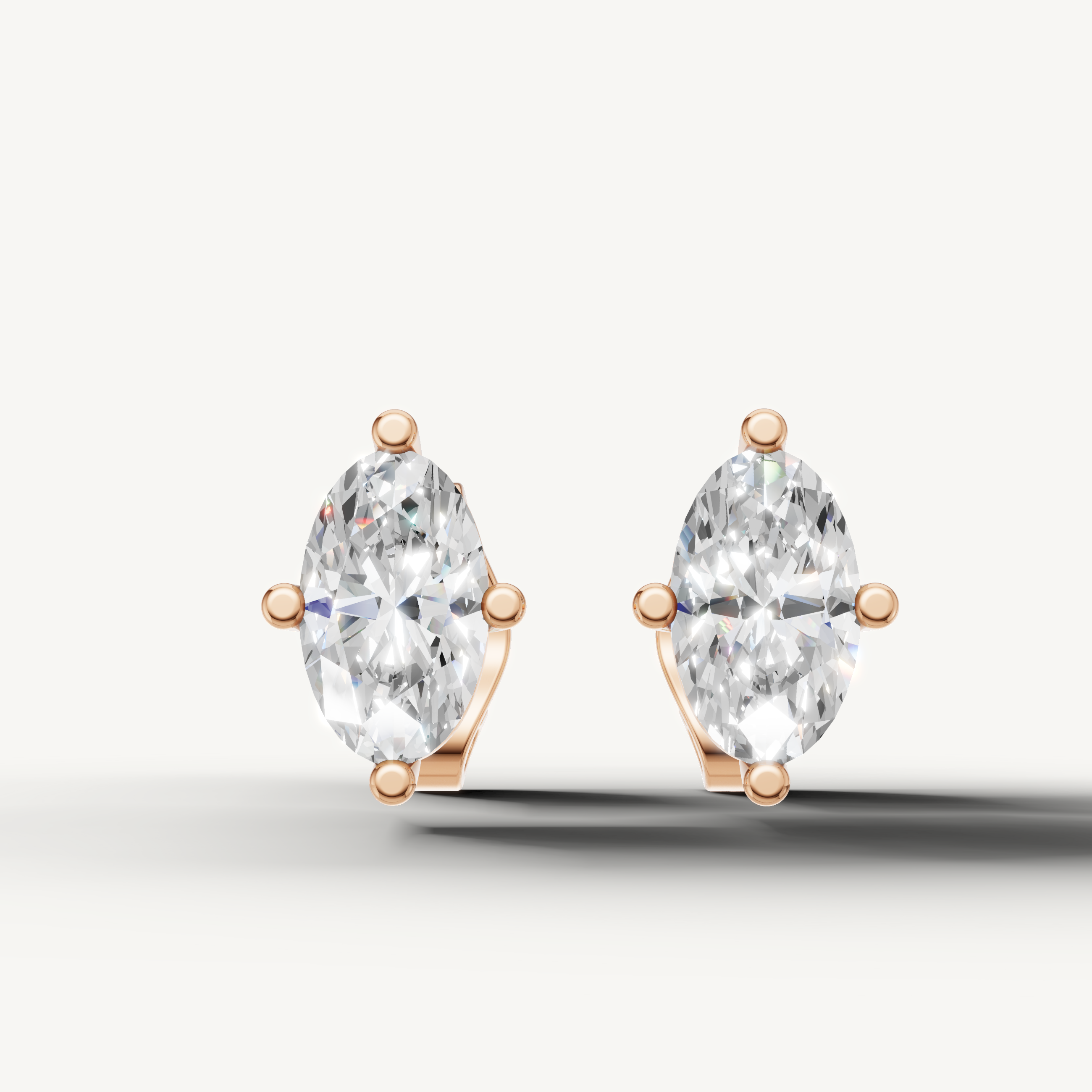 Raul Diamonds rose gold marquise diamond stud earrings with classic solitaire fine jewelry styling