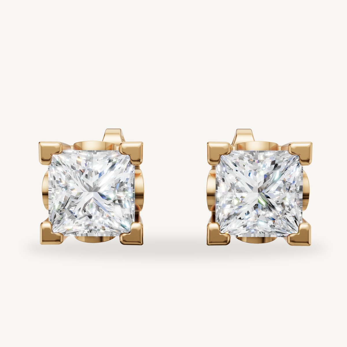 Princess cut lab grown diamond stud earrings in 14K yellow gold by Raul Diamonds