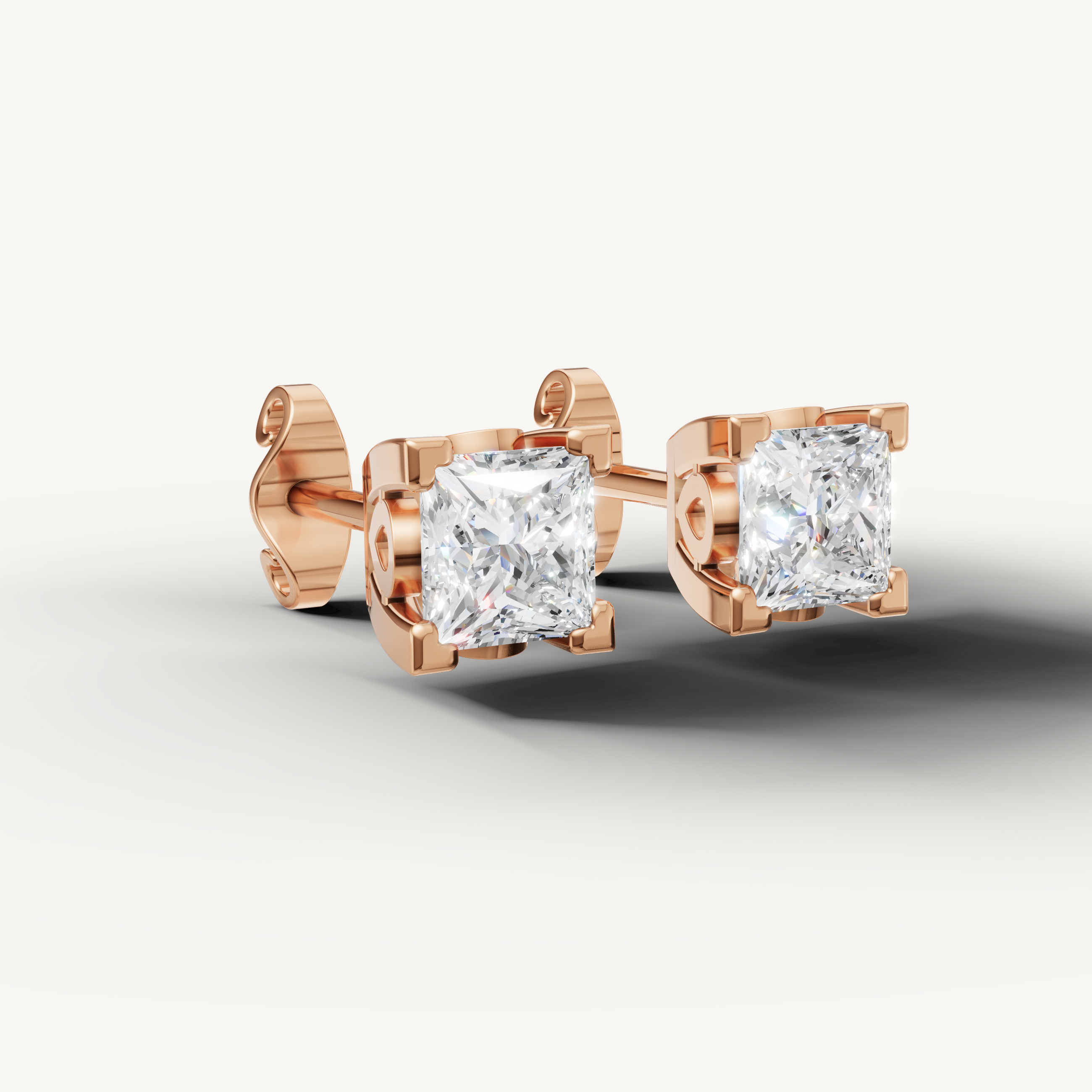 Luxury rose gold solitaire stud earrings for women crafted with princess cut diamonds by Raul Diamonds