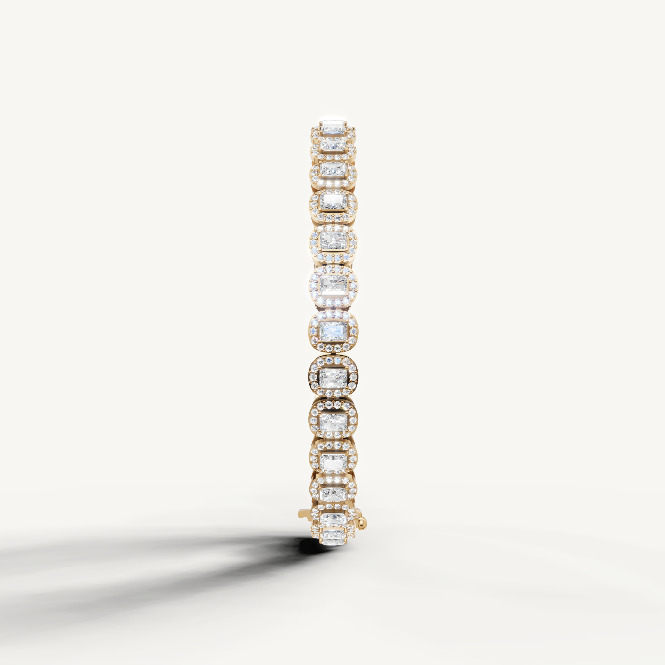 Luxury yellow gold diamond bracelet with radiant emerald stones by Raul Diamonds