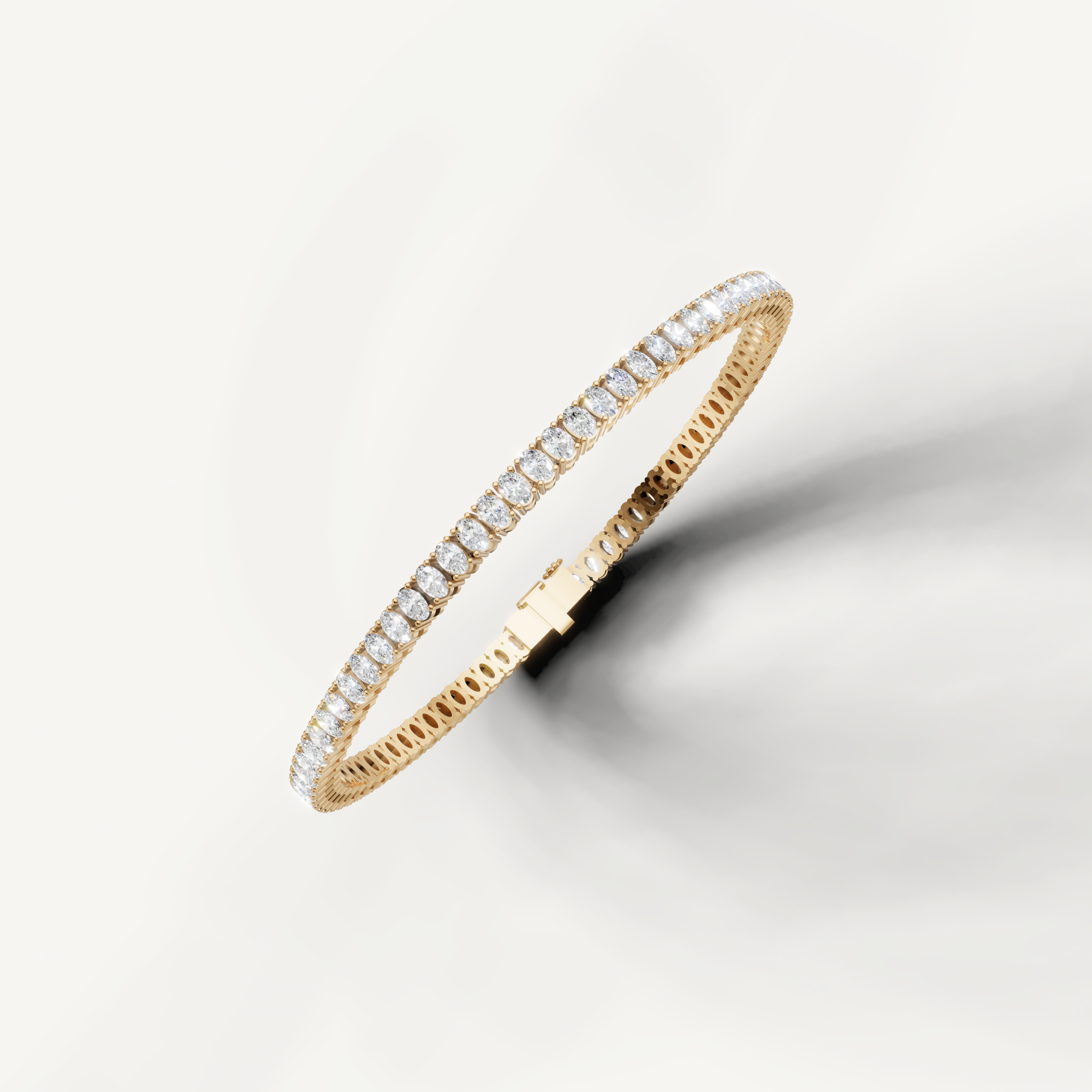 Yellow gold tennis bracelet with sparkling oval diamonds bridal jewelry
