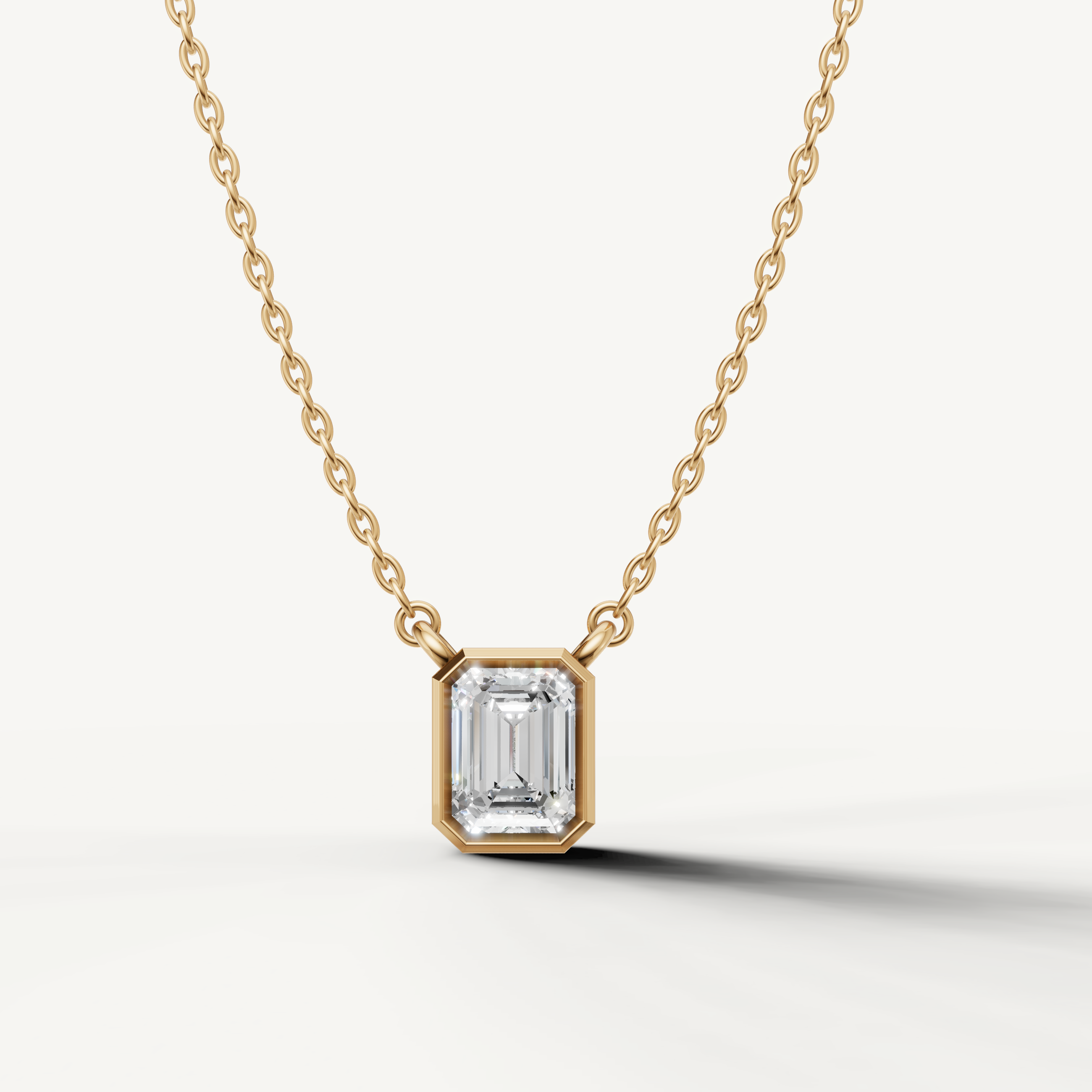 Emerald Cut Lab Grown Diamond Bezel Pendant Necklace in 14K Yellow Gold by Raul Diamonds