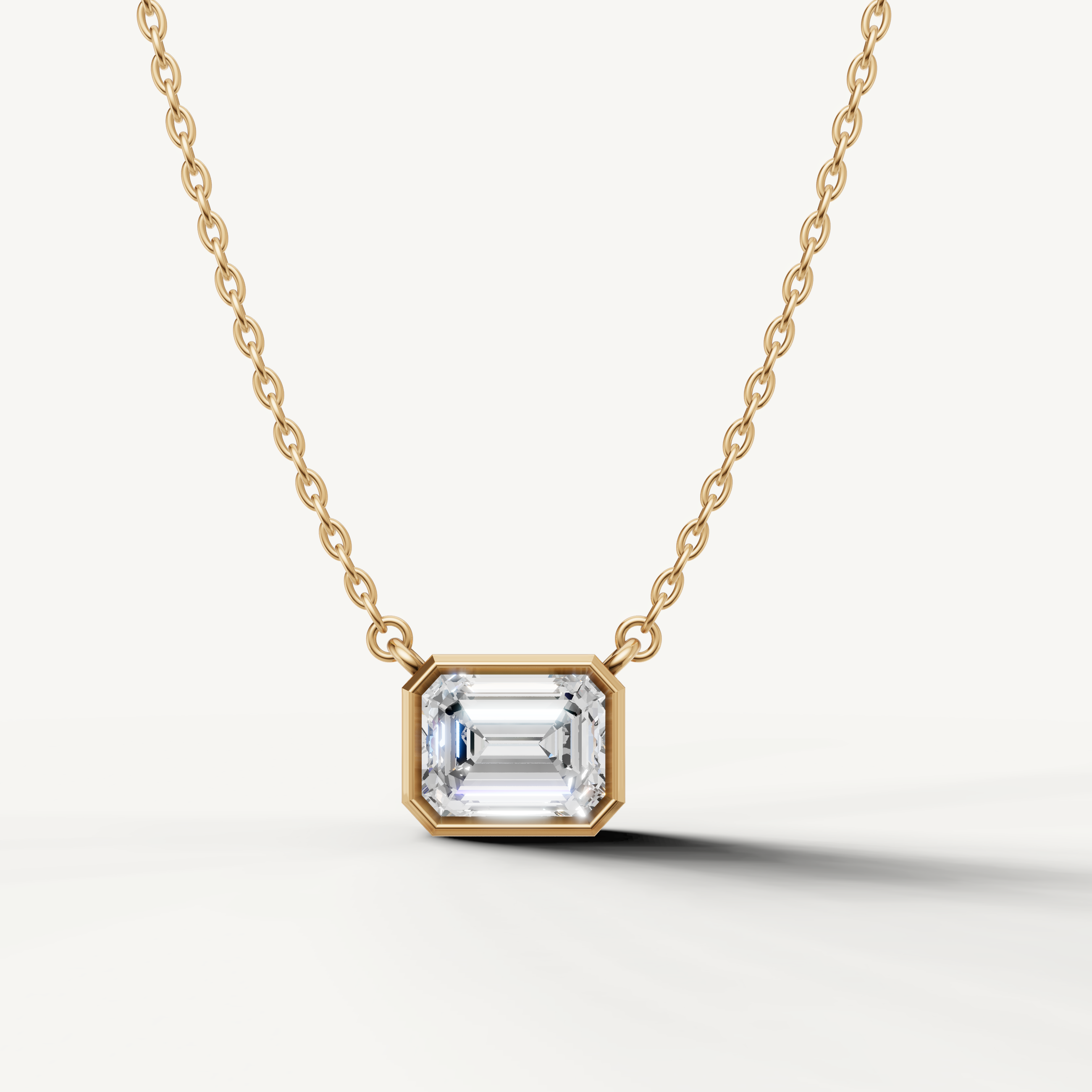 Emerald Cut Lab Grown Diamond Bezel Pendant Necklace in 14K Yellow Gold by Raul Diamonds