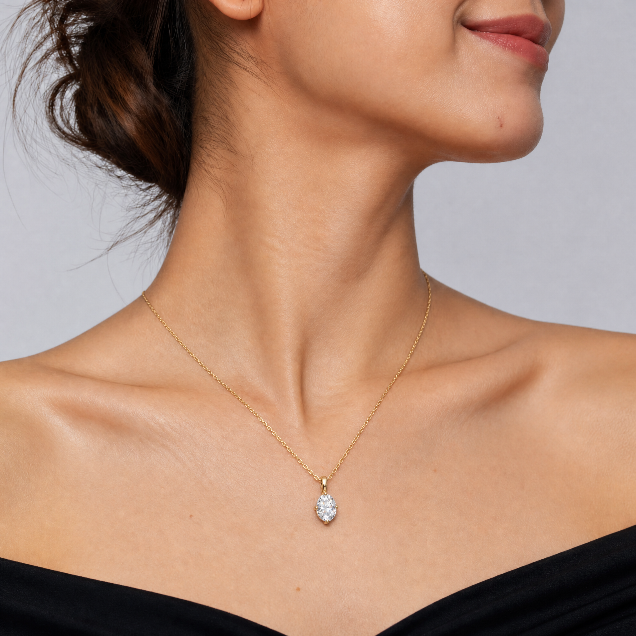 Female Model Wearing Oval Lab Grown Diamond Solitaire Pendant Necklace in 14K Gold by Raul Diamonds