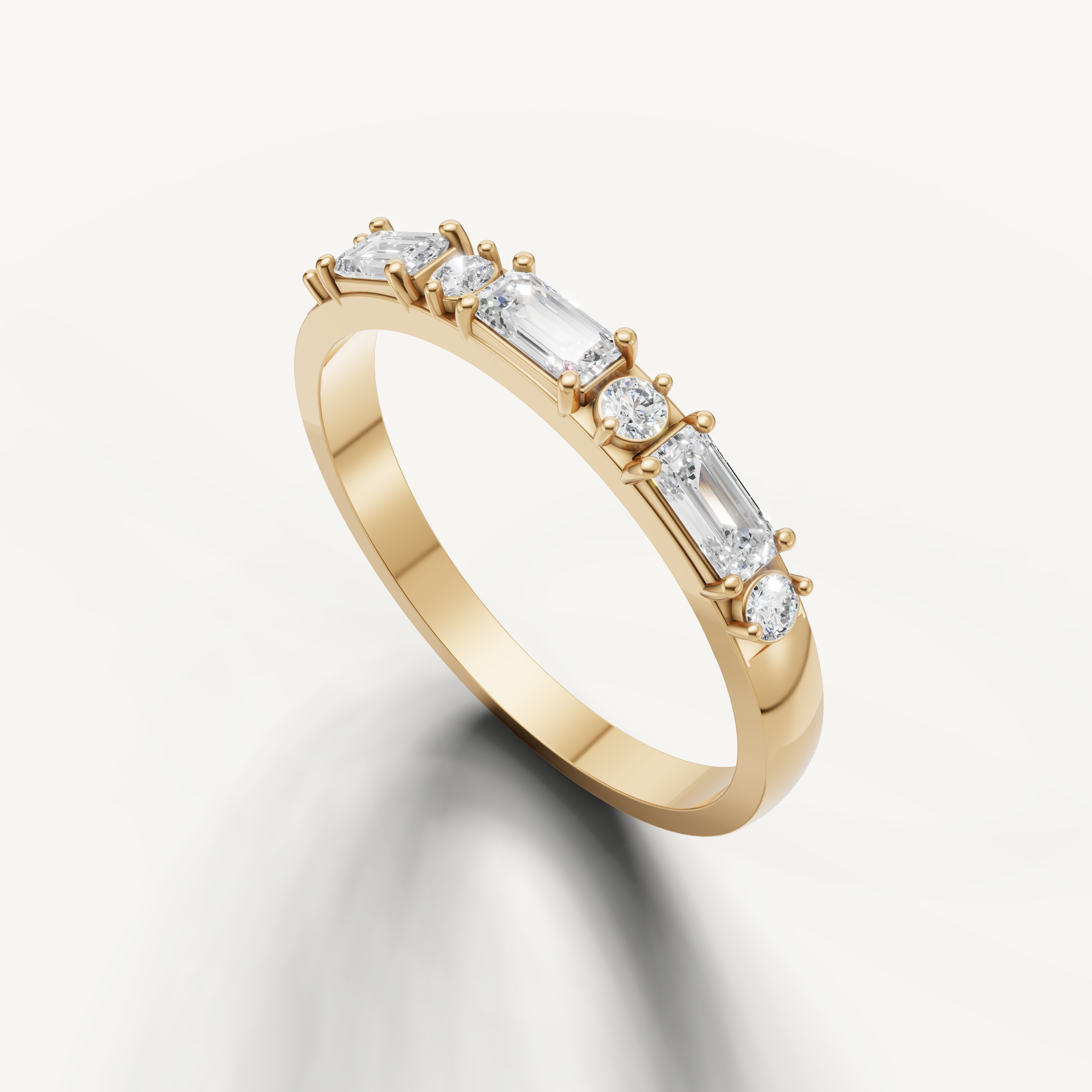 Yellow gold diamond wedding ring with alternating emerald and round diamonds for women