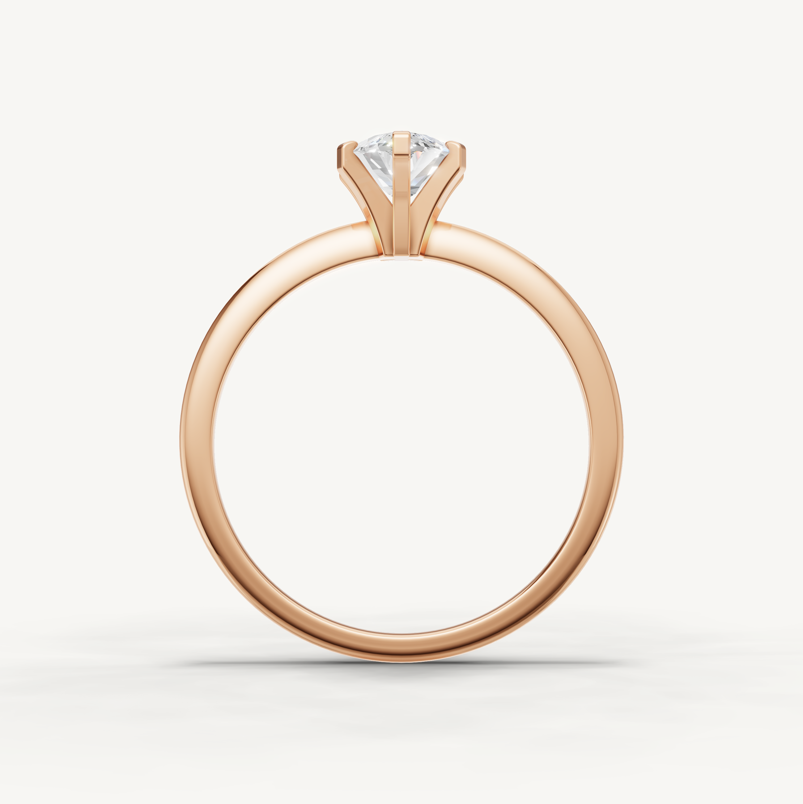 Thin band marquise cut solitaire ring in rose gold by Raul Diamonds