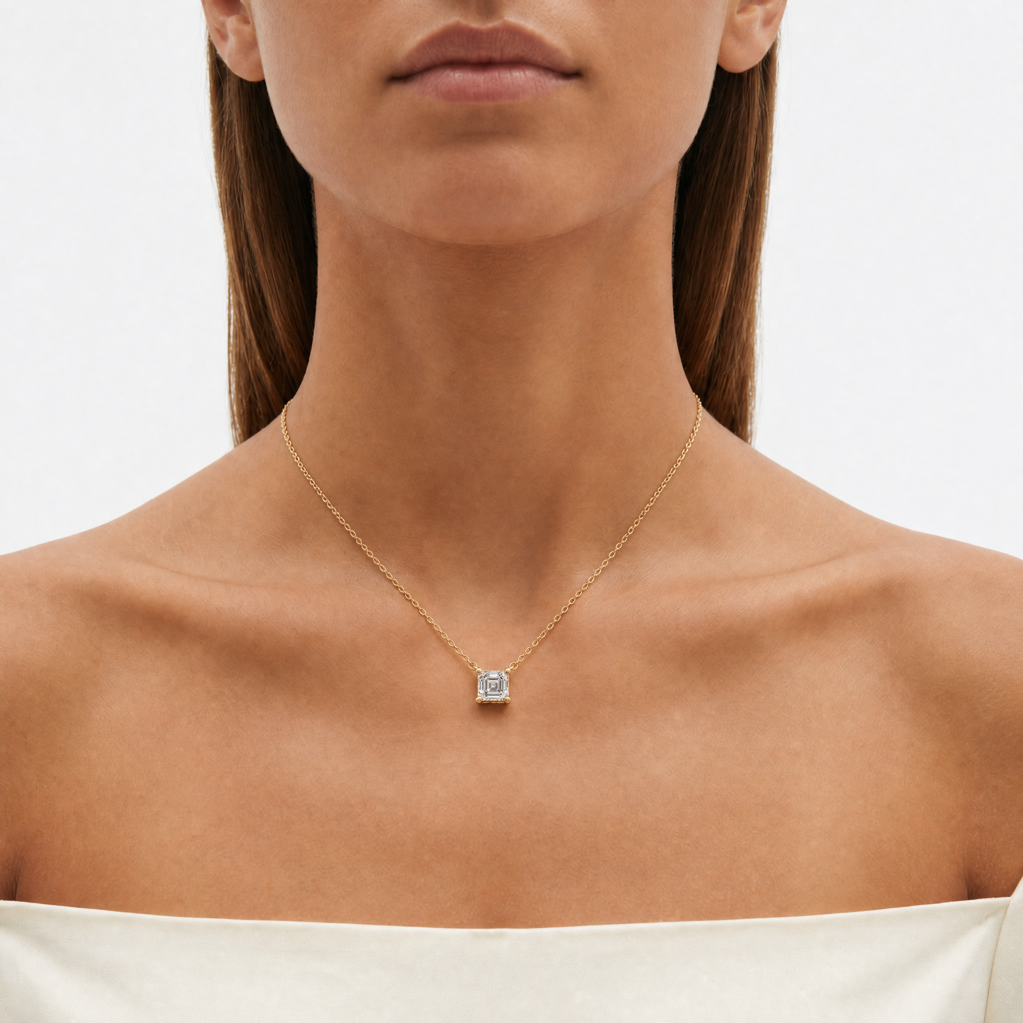 Female Model Wearing Asscher Cut Lab Grown Diamond Bezel Pendant Necklace in 14K Gold by Raul Diamonds