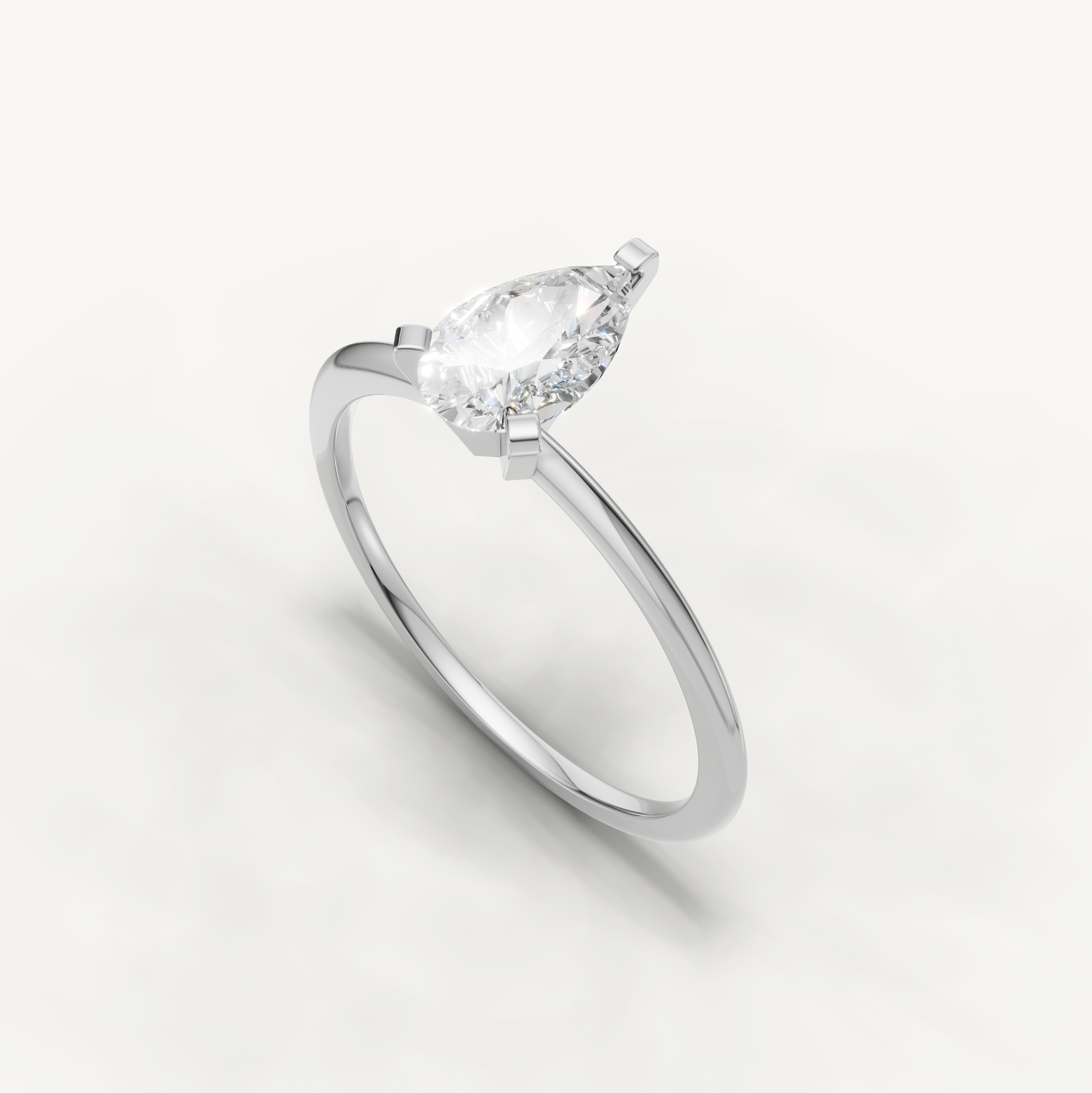 Minimal white gold pear cut solitaire ring with lab grown diamond by Raul Diamonds
