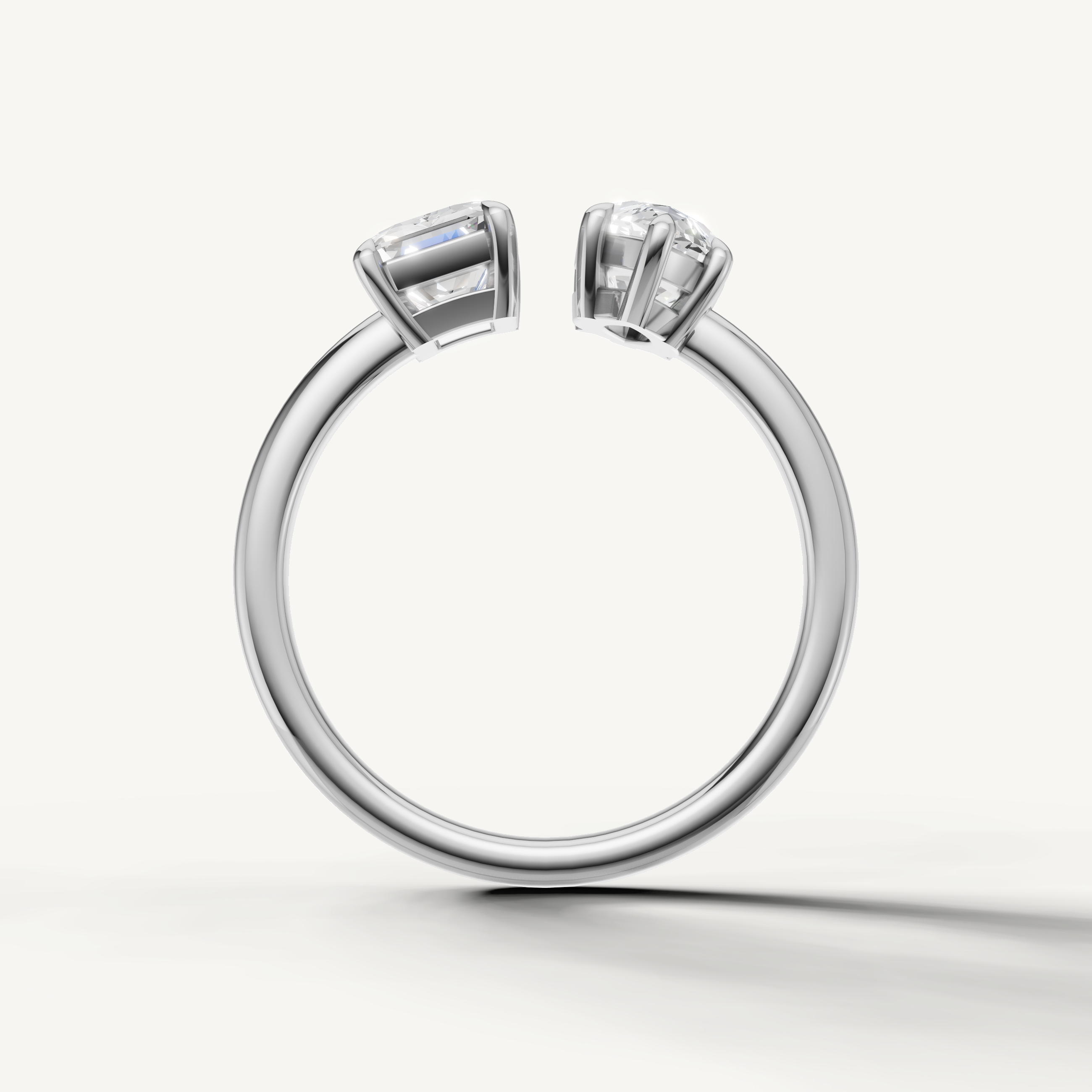 Luxury white gold marquise and emerald cut diamond ring with modern open setting by Raul Diamonds